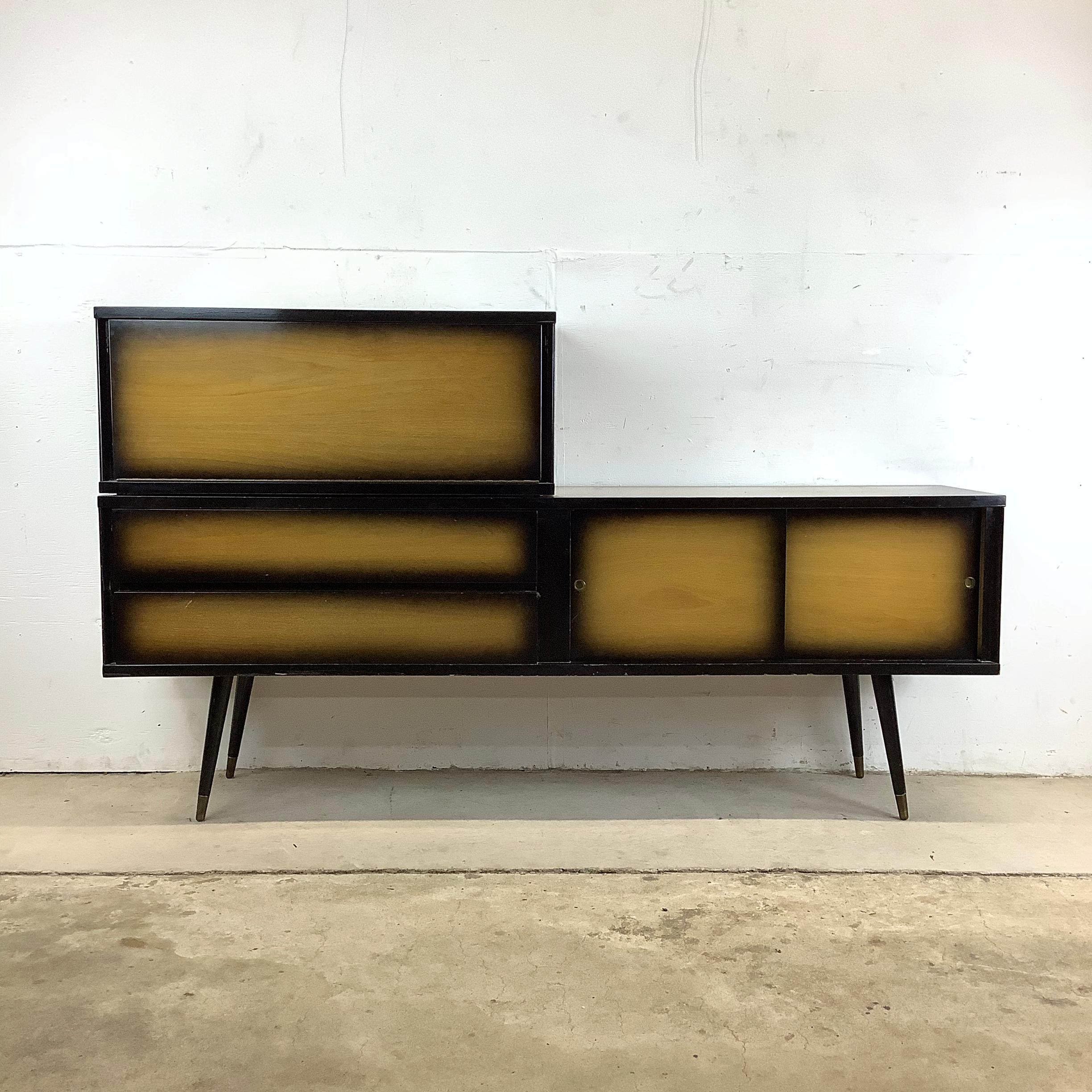 This stunning two-piece mid-century bar exudes vintage charm and sophistication, perfect for elevating your home entertaining experience. Crafted in the 1960s, this exceptional piece combines form and function with its distinctive sunburst finish