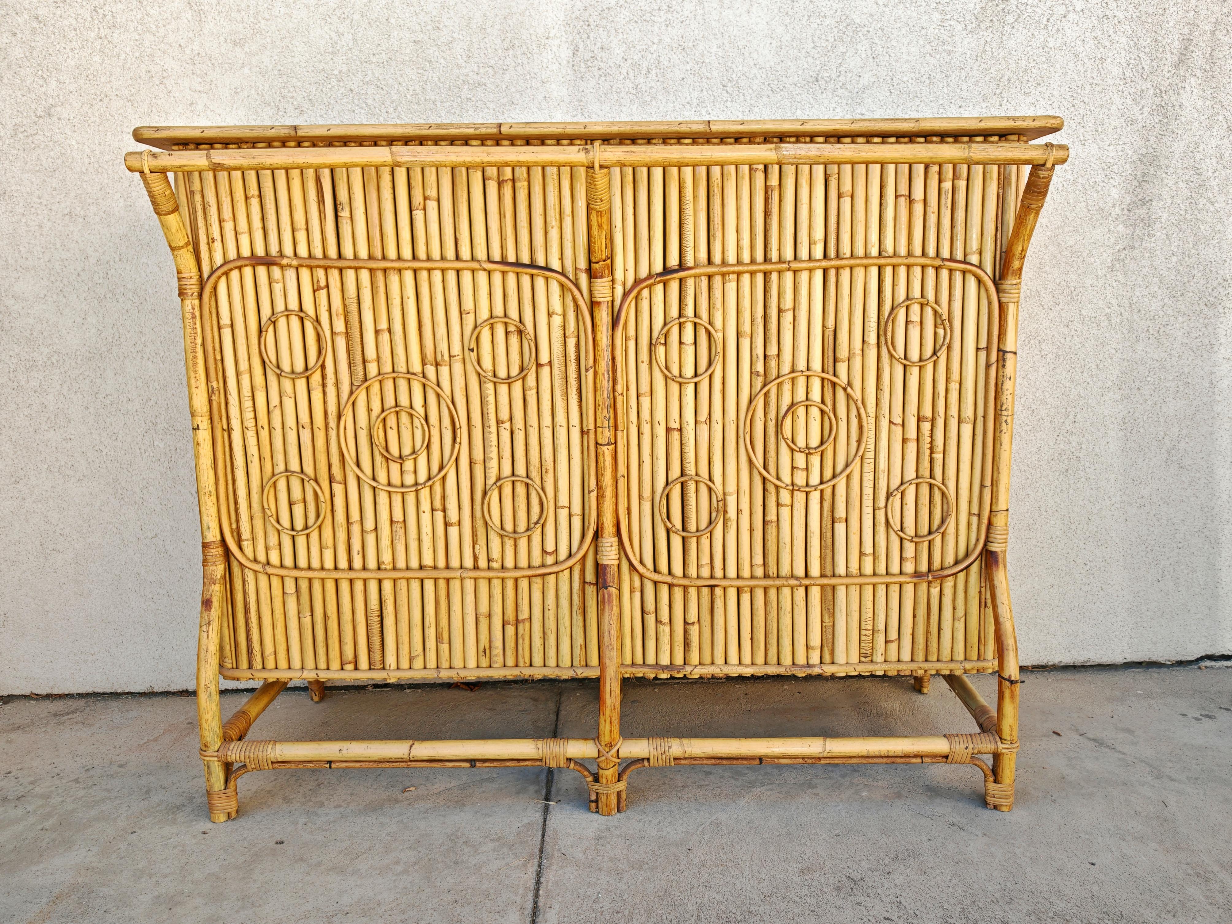 In this listing you will find a marvelous organic dry bar in a gorgeous mix of bamboo, curved rattan, woven wicker and formica. Design of this stylish bar is atrr. to Tito Agnoli and it's estimated to be made in Italy during the 1950s.

Fully