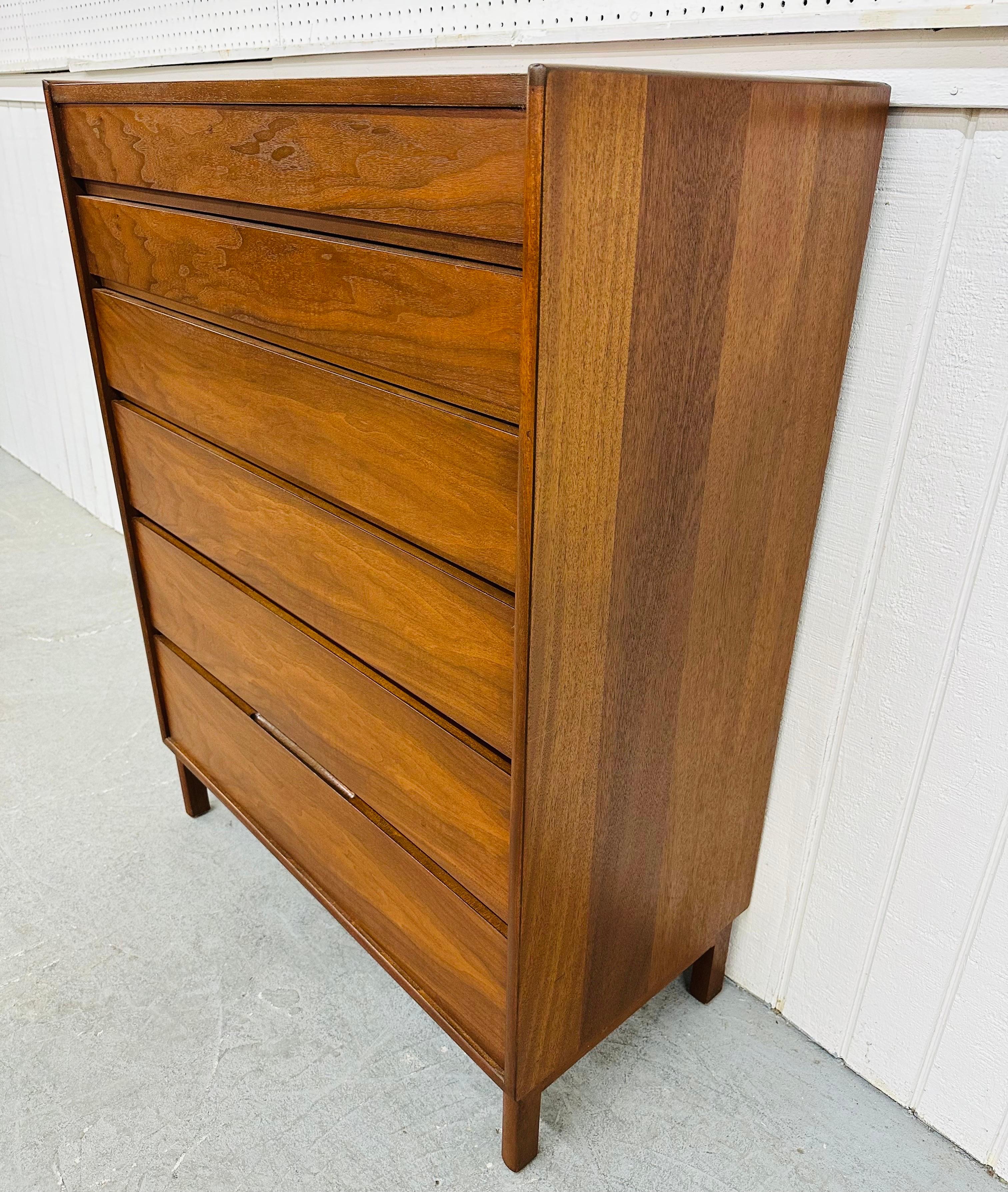 This listing is for a Mid-Century Modern Dunbar for Edward Wormley Walnut High Chest. Featuring a straight line design, six graduated drawers for storage, modern legs, and a beautiful walnut finish. This is an exceptional combination of quality and