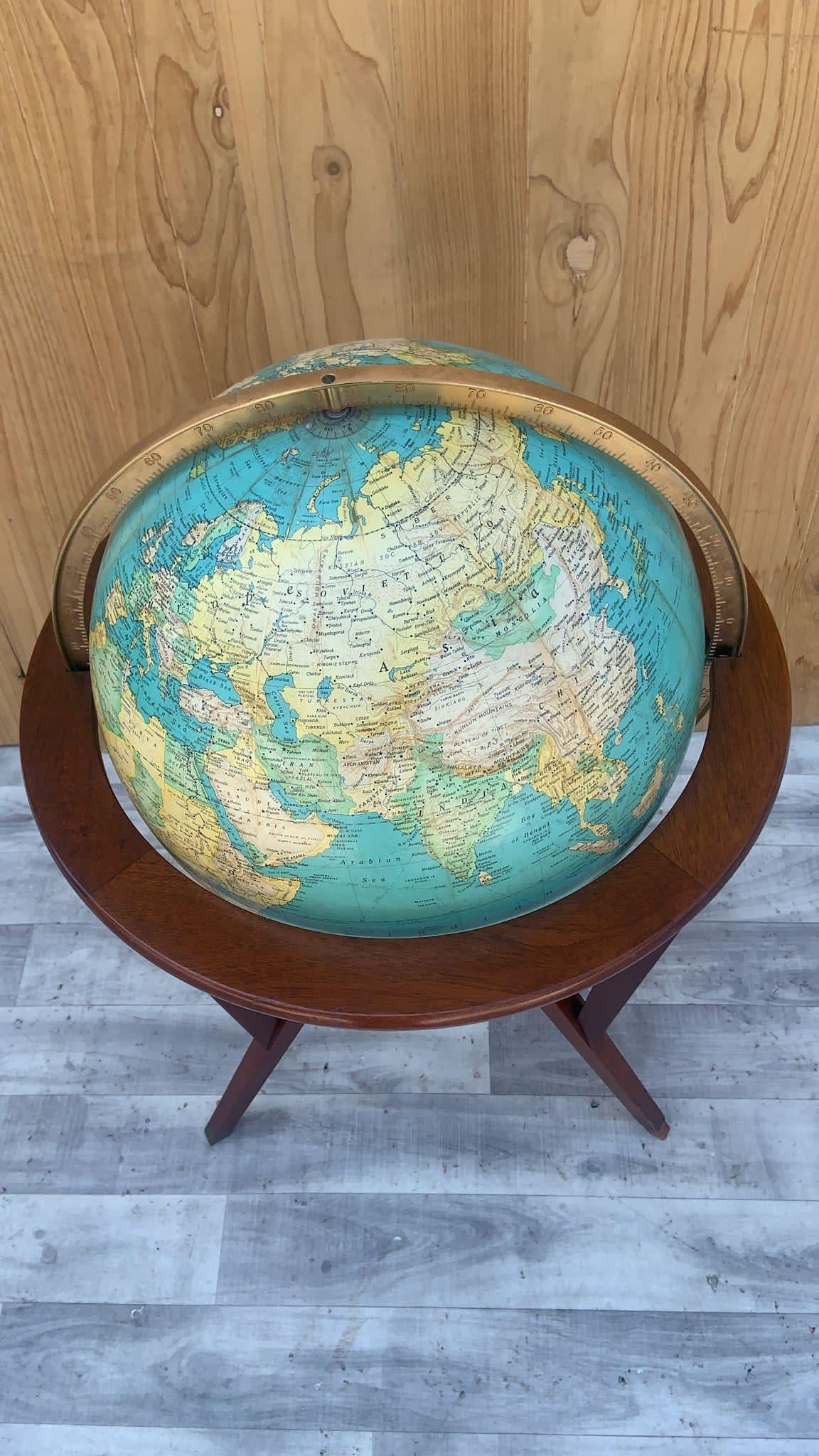 Mid Century Modern Dunbar Illuminated Floor Globe by Edward Wormley

This beautiful and classic Dunbar Illuminated Floor Globe by Edward Wormley would be a perfect addition to any mid century home. The globe is in working condition and it rotates