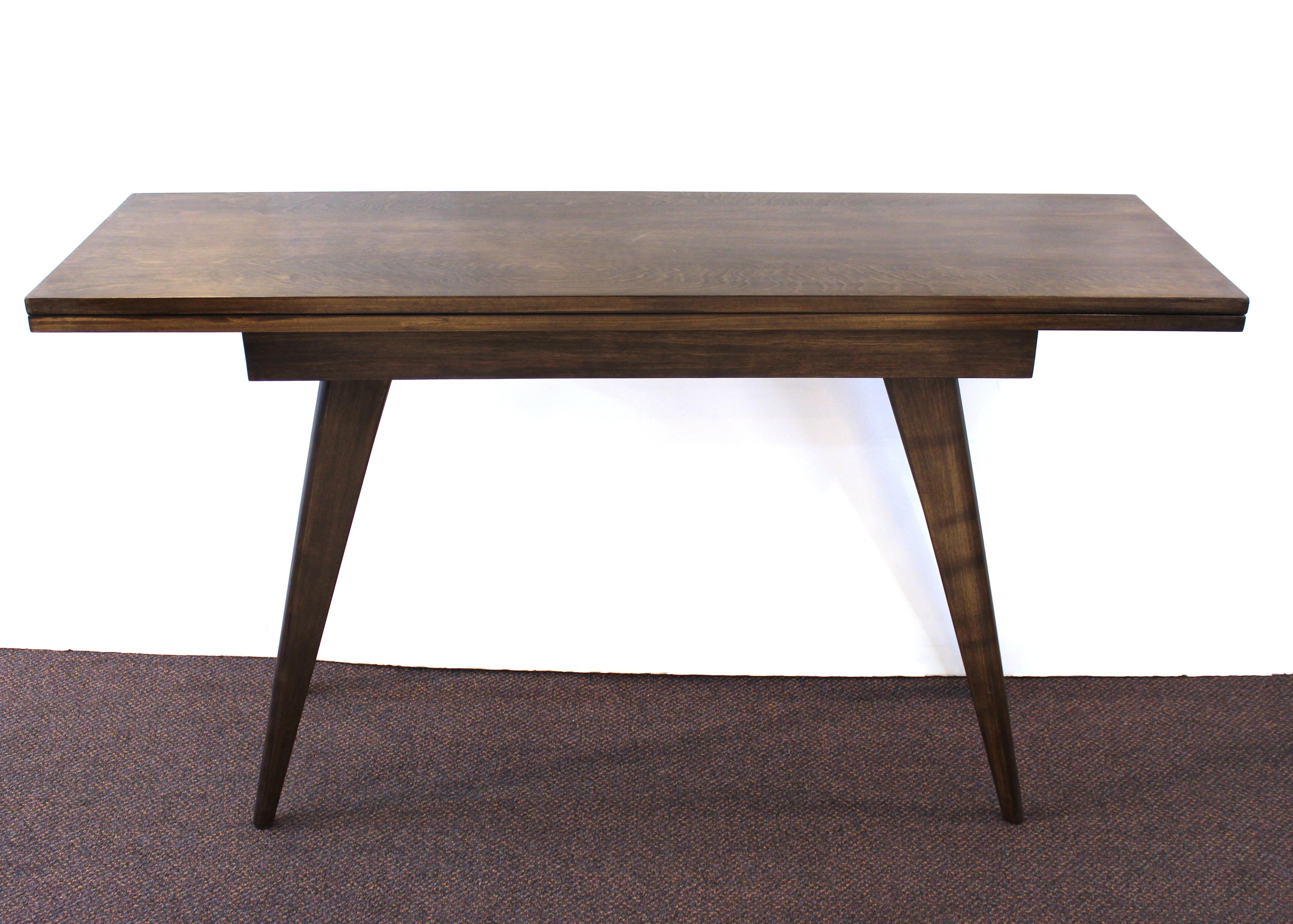Mid-Century Modern Dunbar style flip-top wood dining table or console. The piece is in great vintage shape.