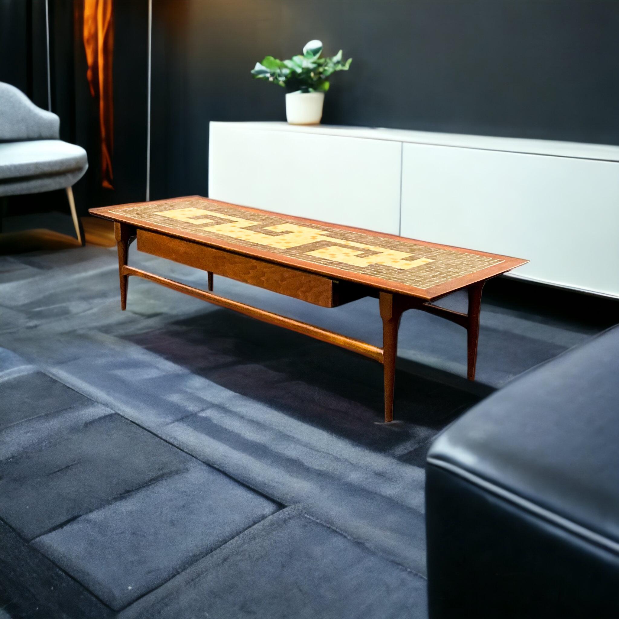 This is a good looking mid-century modern walnut coffee table with a single drawer and mosaic tile top. It is in very good condition and is unmarked.

My shipping is for the Continental US only, and it can run two to five weeks.