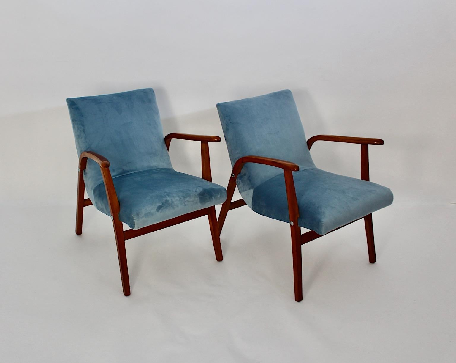 Mid Century Modern Modernist freestanding vintage pair armchairs from beech and pastel blue velvet by Roland Rainer for Cafe Ritter 1950s Vienna.
An amazing and iconic pair or duo armchairs from beechwood and newly covered seat and back with pastel