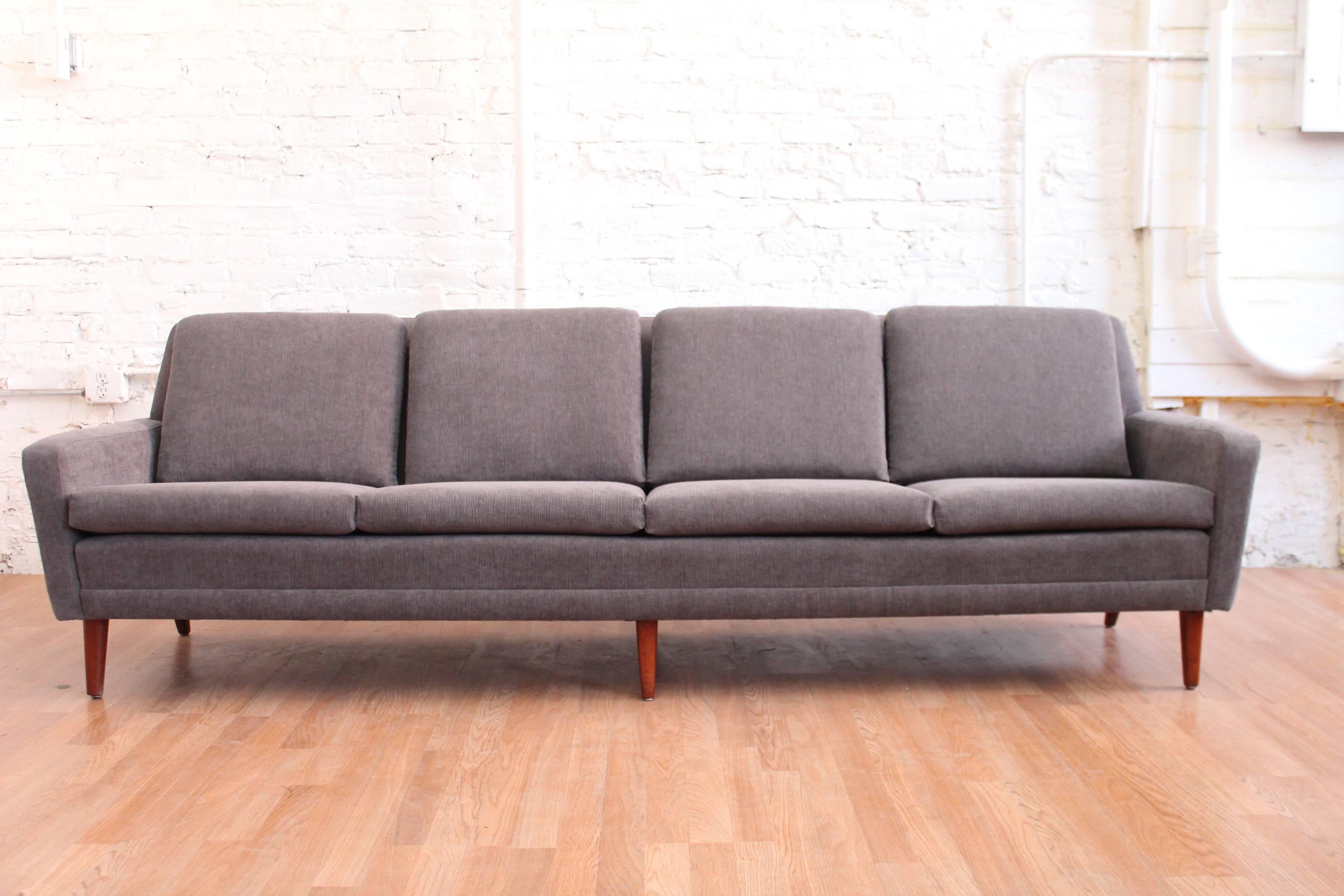 Folkes Ohlsson for Dux! This is the modernists/modernista's dream sofa. The unicorn if you will. Isn't it time for you to capture this elusive sexy beast?! Newly and perfectly re-upholstered in our signature Gentlemens grey fabric. The design is