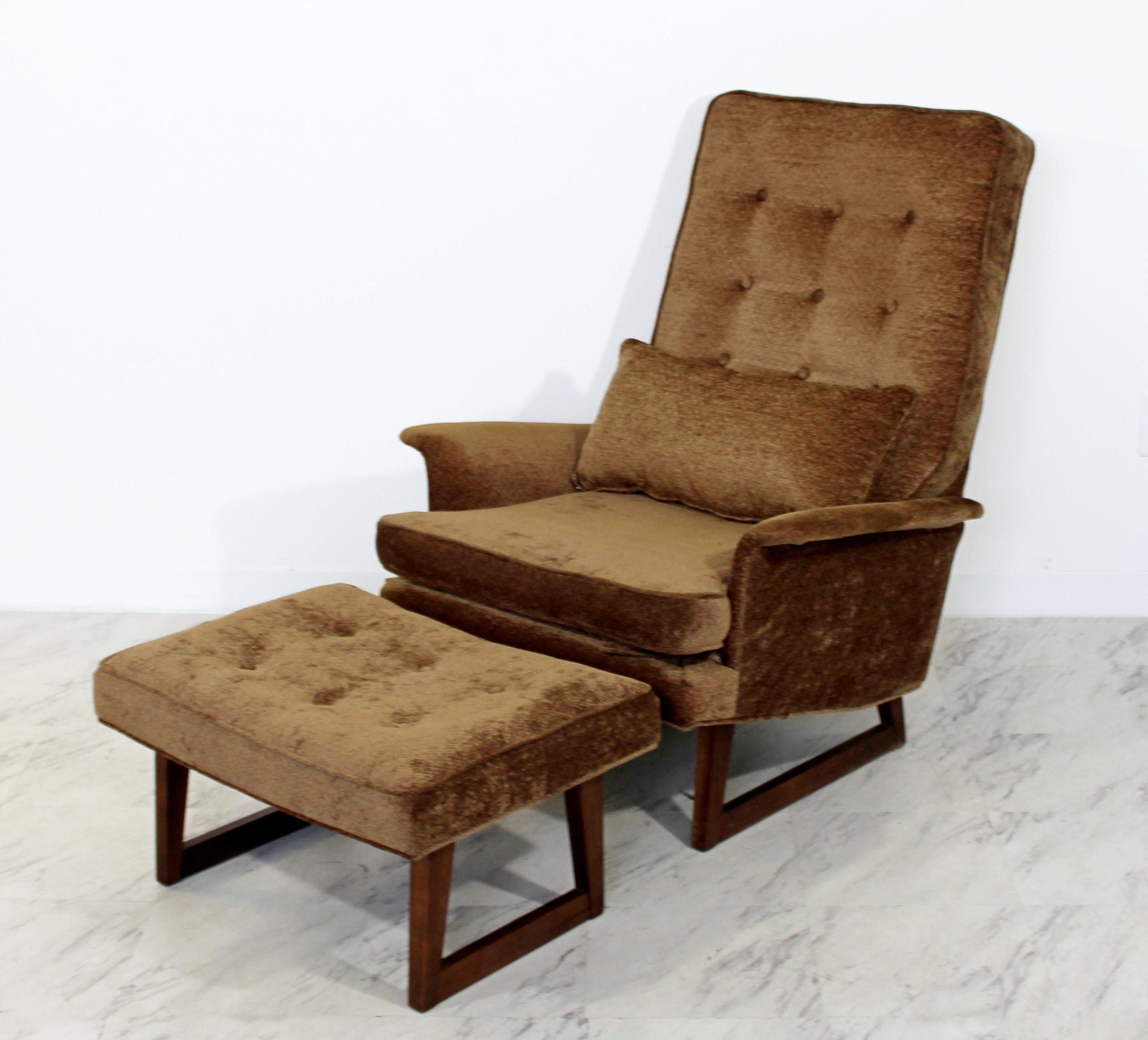 For your consideration are a gorgeous lounge armchair and matching ottoman, by Danish company DUX, circa the 1960s. In very good condition. The dimensions of the chair are 32