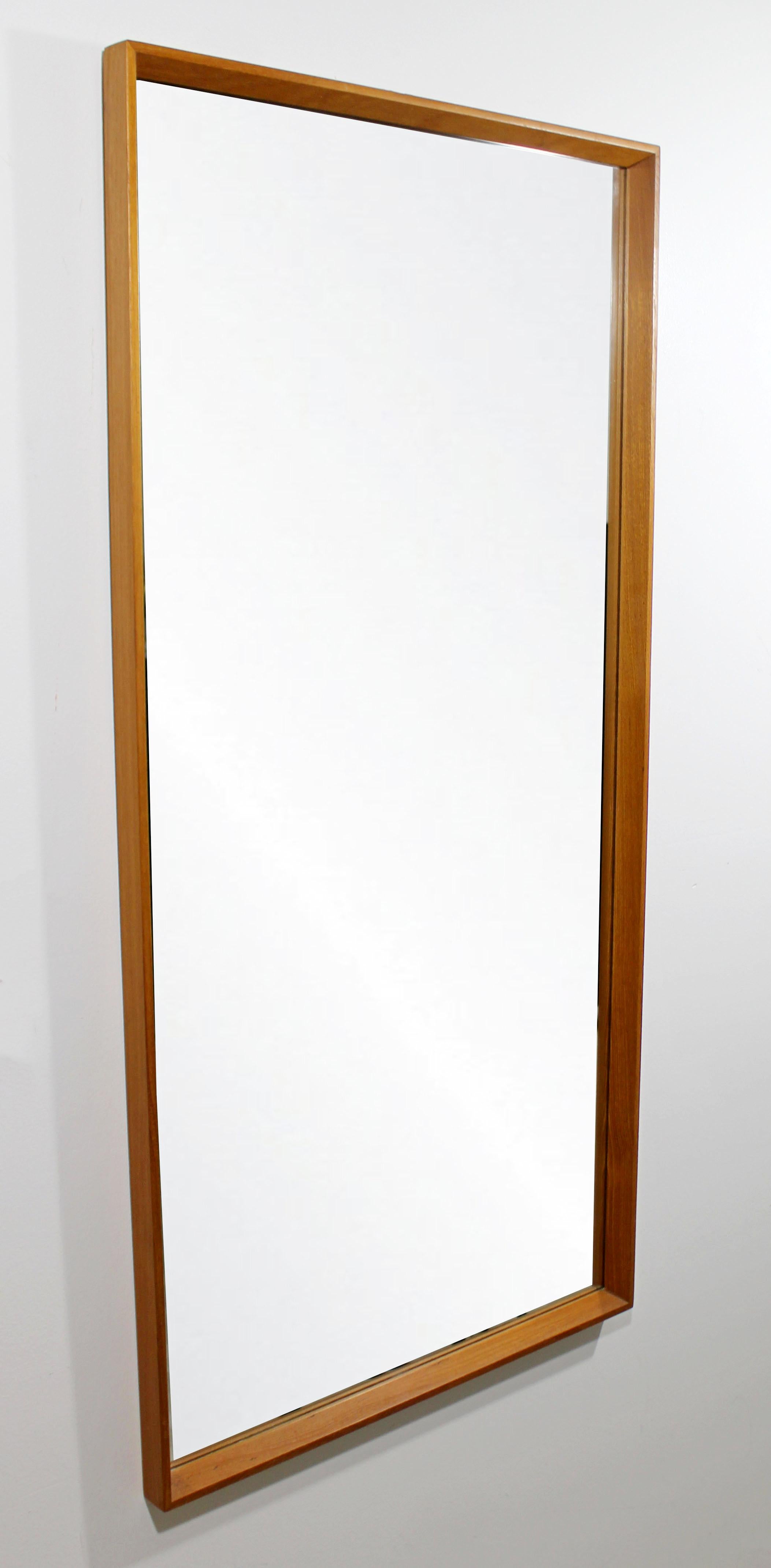 For your consideration is a simple and chic, rectangular wall mirror, by Danish company Drylund, circa 1960s. In excellent vintage condition. The dimensions are 22