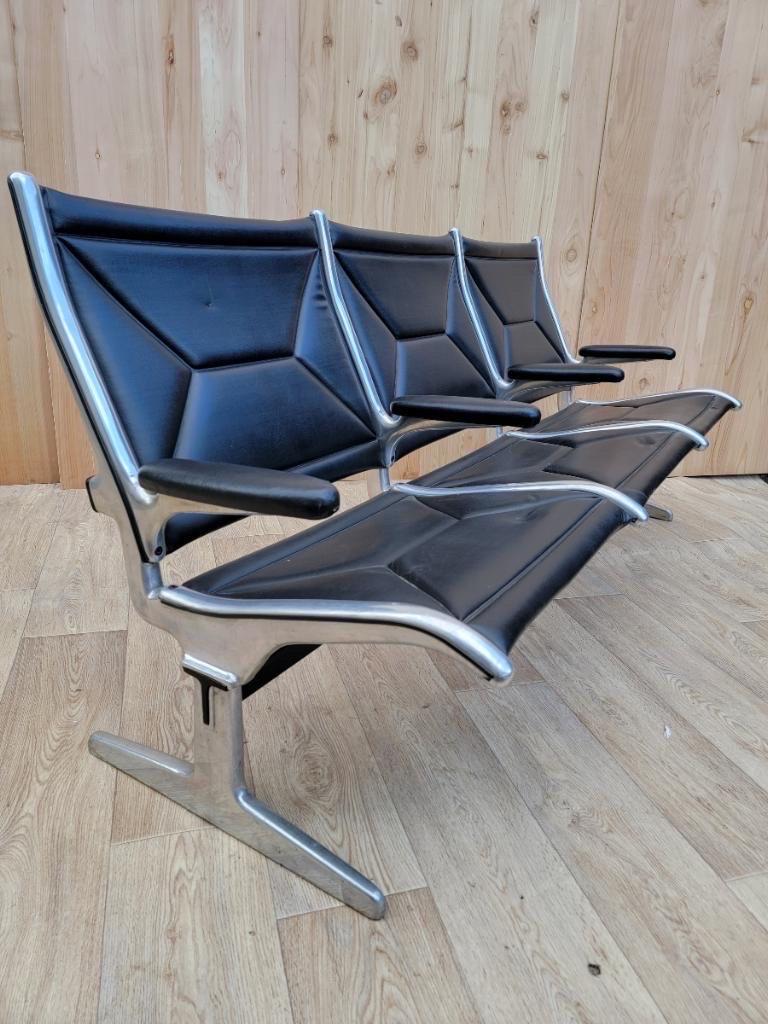 Mid Century Modern Eames 3 tandem sling airport bench for Herman Miller

Iconic black leatherette, solid aluminum tandem sling 3-seat airport bench, designed by Ray & Charles Eames for Herman Miller. The Eames Brothers were commissioned to design