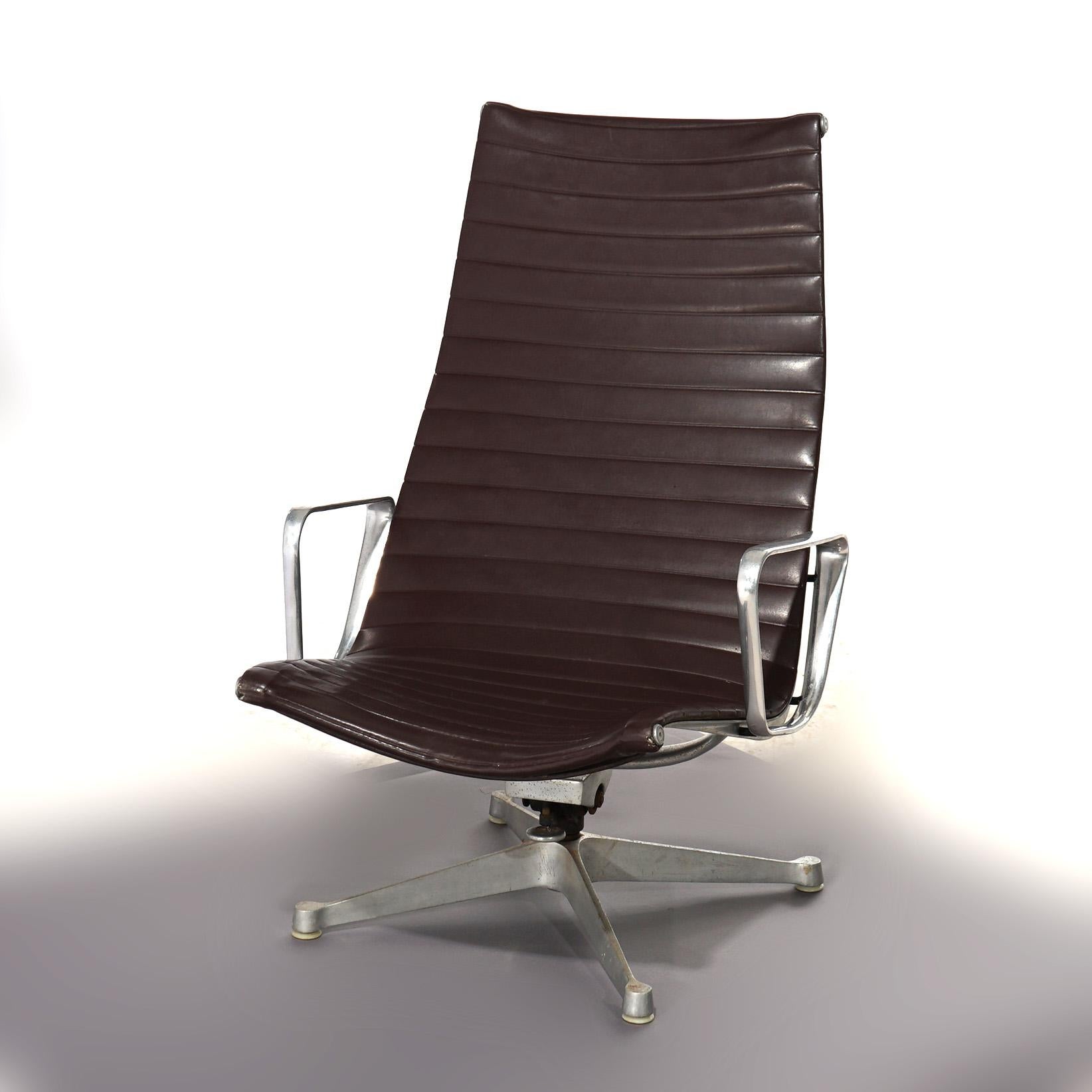 A Mid Century Modern Eames by Miller (attr.) desk chair offers leather ribbed back and seat on chrome swivel frame, unmarked by maker, C1950

Measures- 39''H x 25.5''W x 29.25''D; 13'' SH