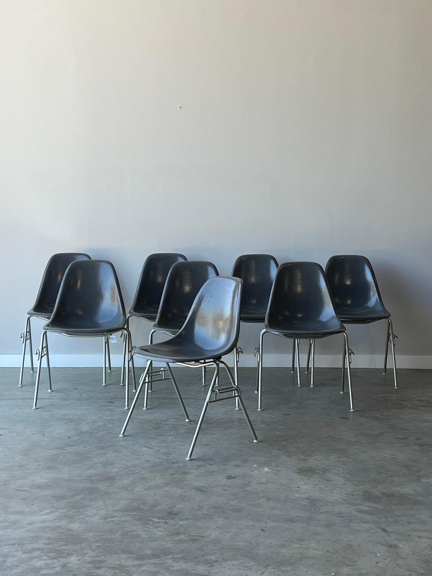Pleased to offer a great collection of 8 Mid Century Modern Herman Miller Eames DSS stacking chairs in elephant hide grey. These chairs are in fantastic vintage condition with no chips or cracks. Minor patina from age not very noticeable through the