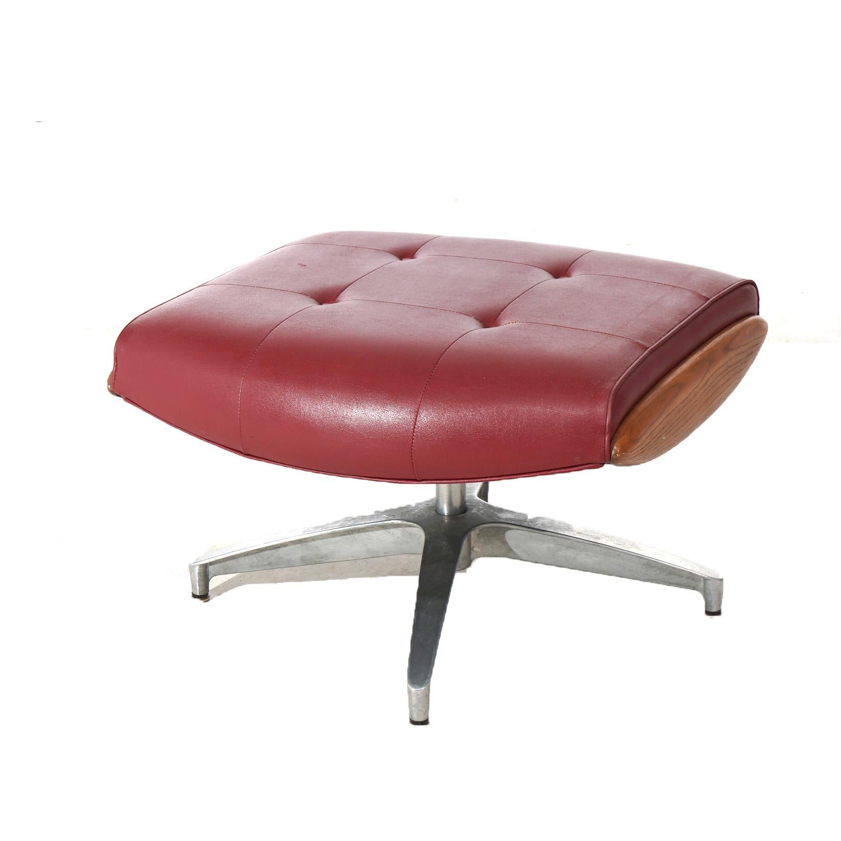 A Mid Century Modern Eames for Miller ottoman offers faux leather button seat in wood frame raised on chrome legs, c1950

Measures - 16.25
