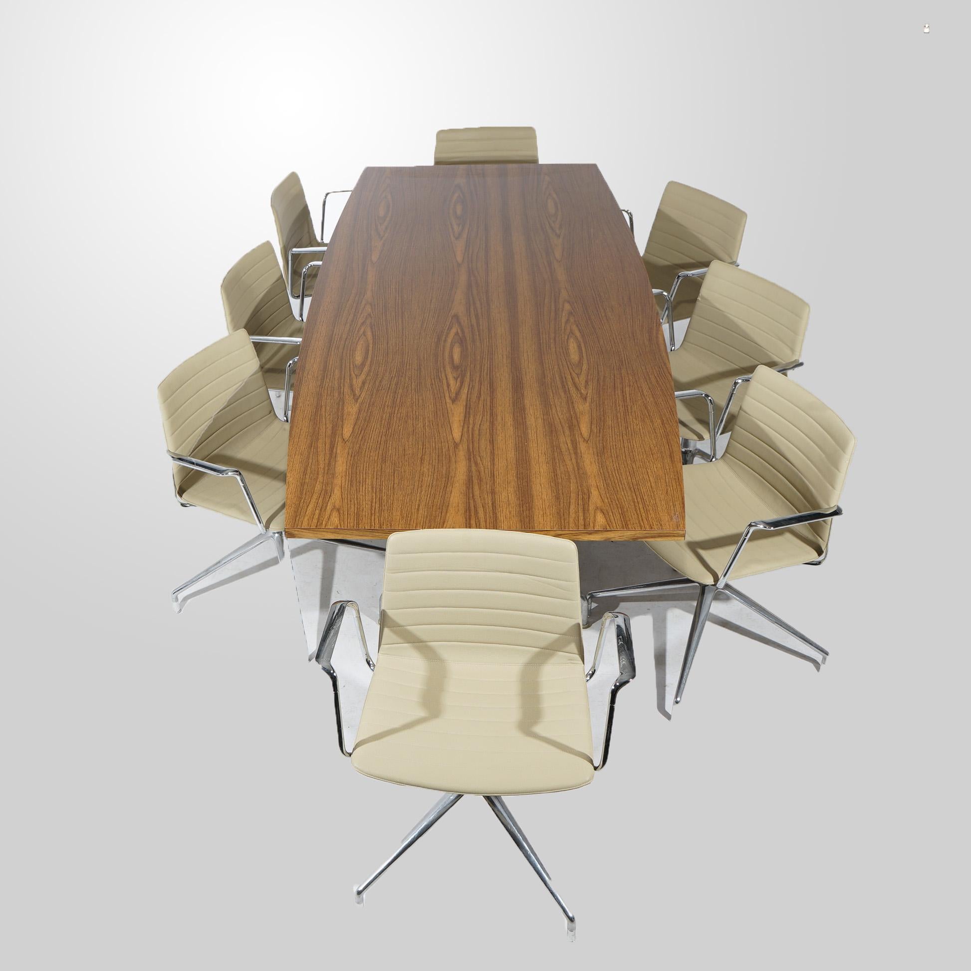 A Mid-Century Modern Eames for Miller dining or conference table offers laminated top raised on double aluminum pedestal legs; set of eight swivel Flex chairs by Piergiorgio Cazzaniga for Andreu World in the manner of Eames for Miller offer ribbed