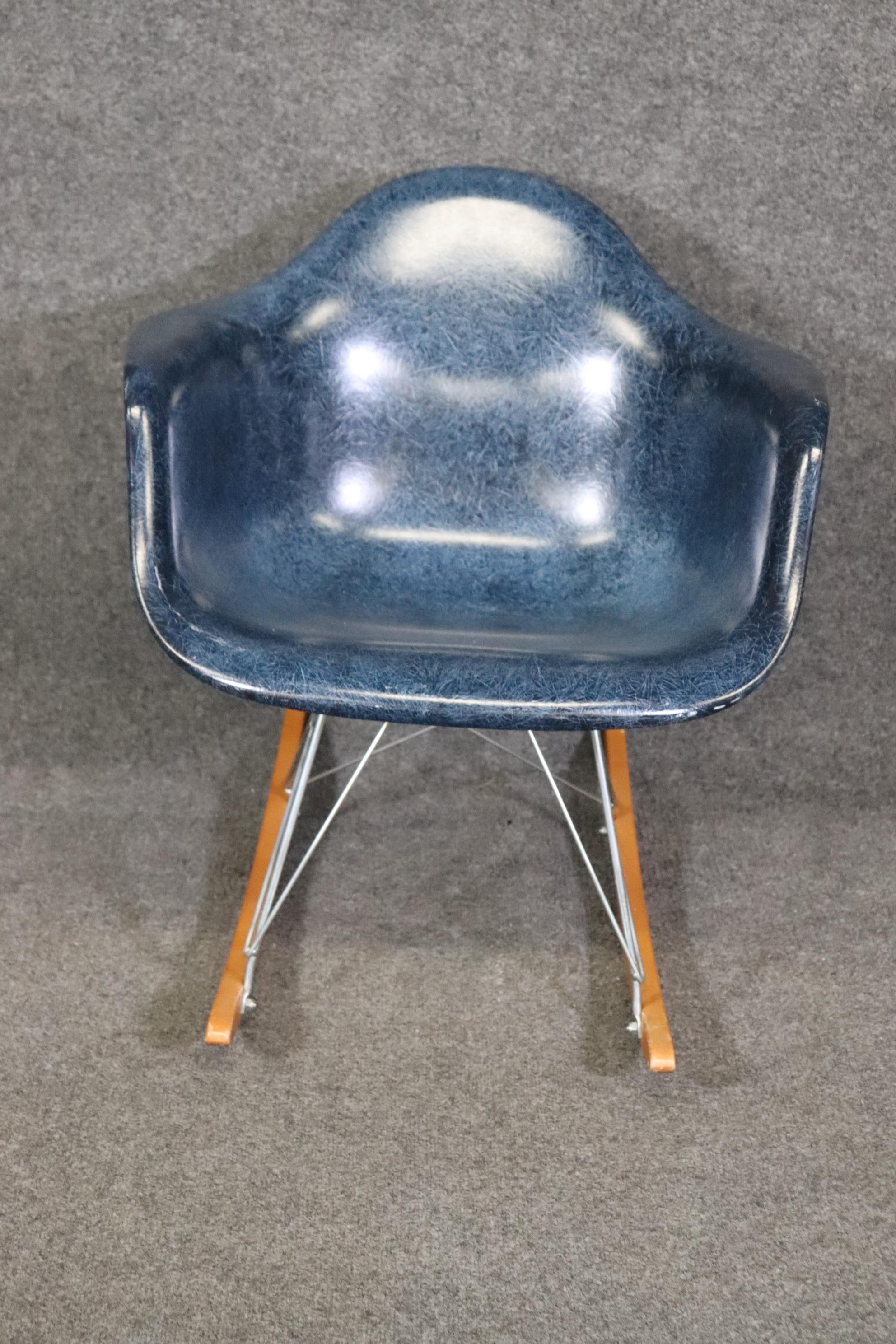 Dimensions- H: 27 1/2in W: 25in D: 27 1/4in SH: 17 1/2in

This Eames for Modernica rocking chair is a piece of art!  If you look at the photos provided, you can see the molded fiberglass chair with waterfall seat supported by a metal frame on walnut