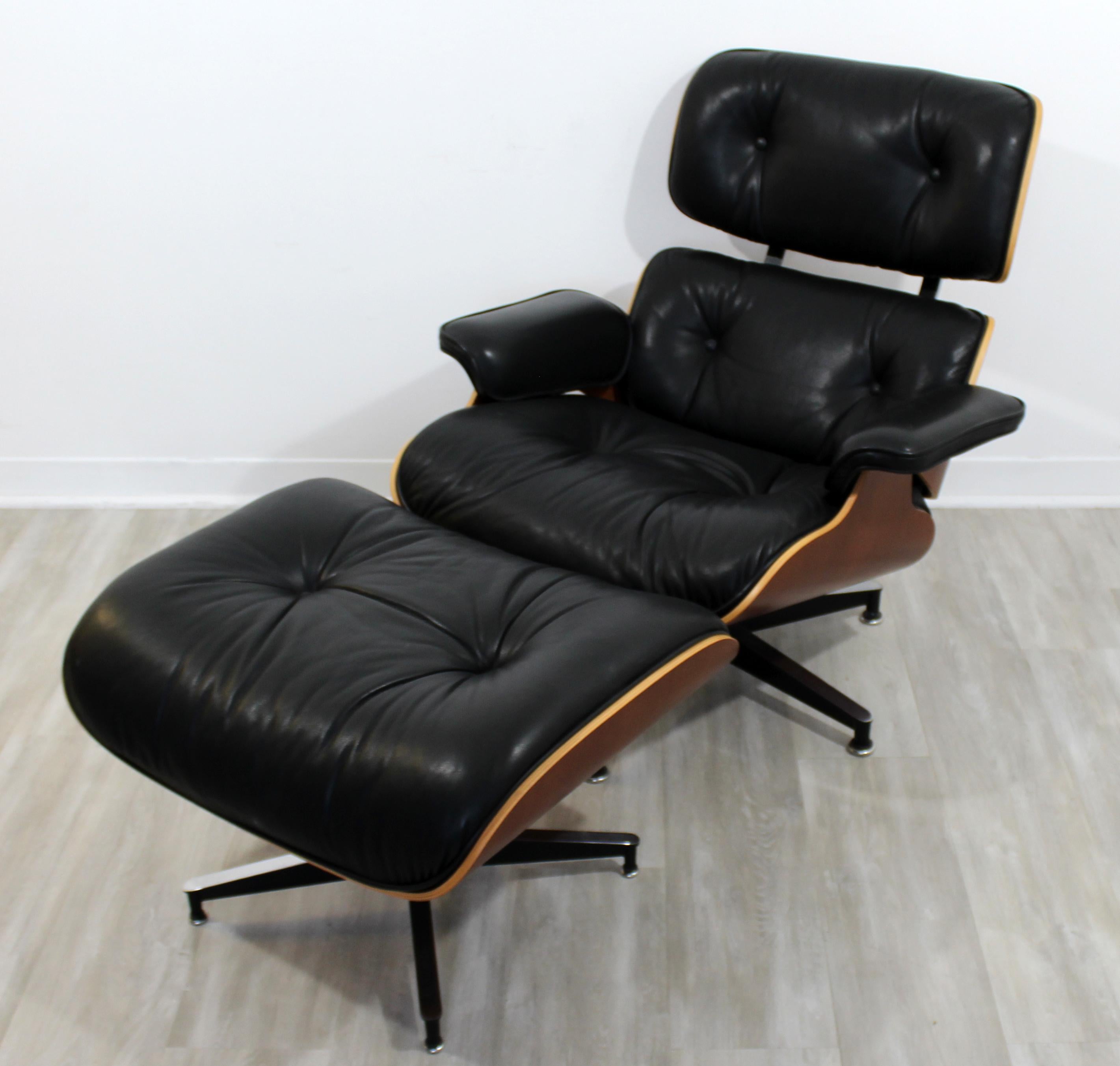 For your consideration is a phenomenal, Charles Eames for Herman Miller iconic, walnut and black leather armchair and matching ottoman, circa 1980s. In excellent vintage condition. The dimensions of the chair are 32.5