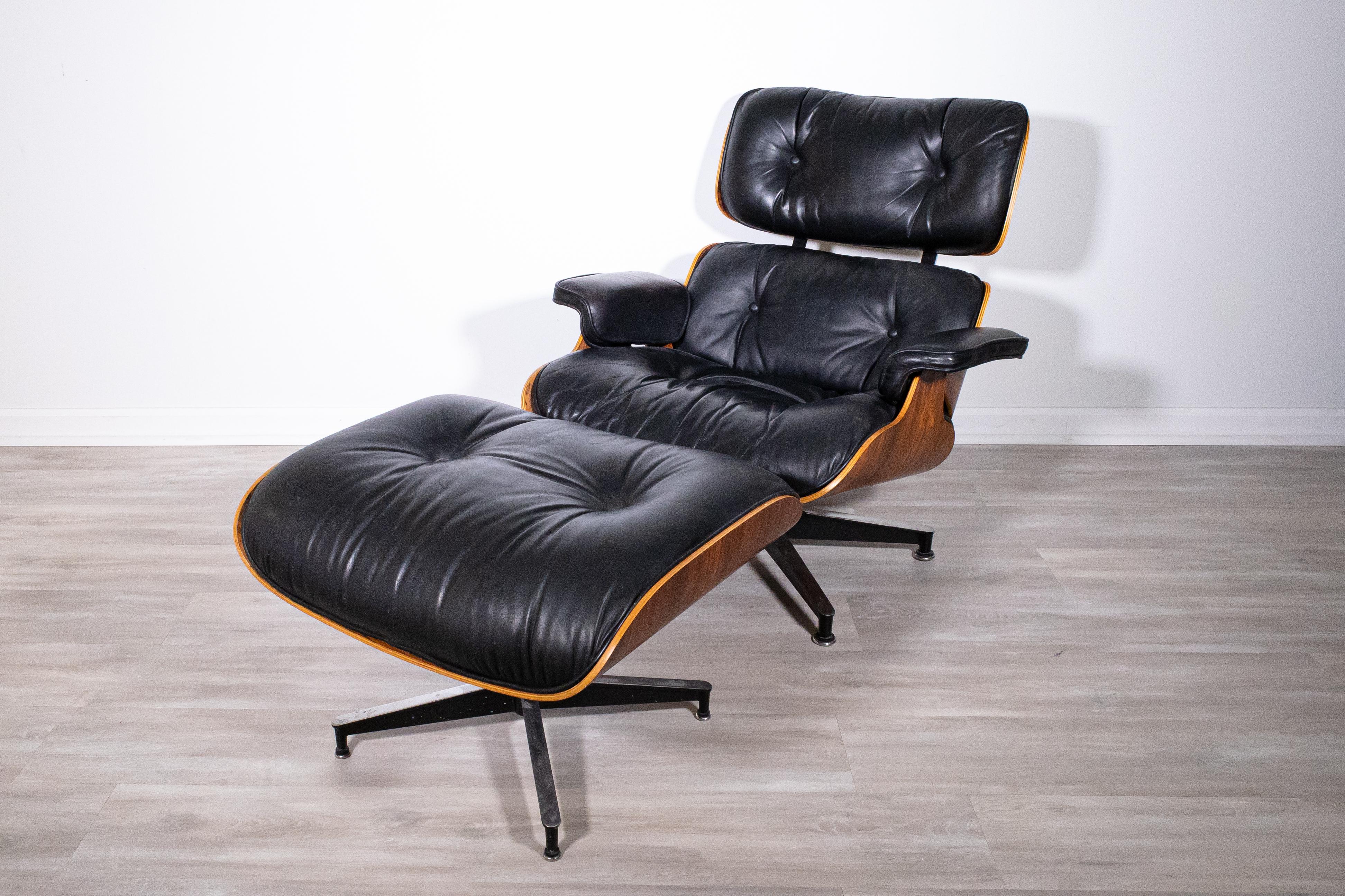 Eames Herman Miller rosewood lounge chair & ottoman 1986. This iconic lounge chair is a staple of mid century modern homes and offices. It features original upholstery and construction. This piece in particular features a rare rosewood finish.