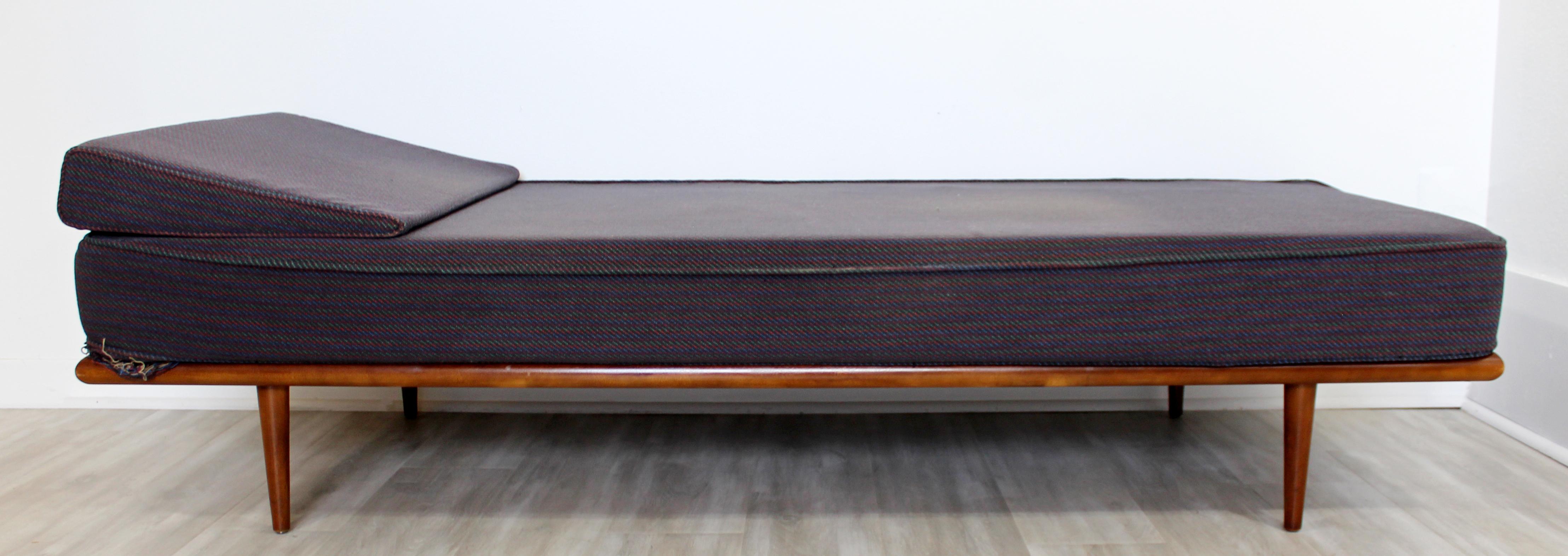 For your consideration is a rare and beautiful, walnut wood daybed or chaise, by George Nelson for Herman Miller, circa 1950s. In excellent vintage condition. Can be used as is, original upholstery, or would be killer in a brand new upholstery. The