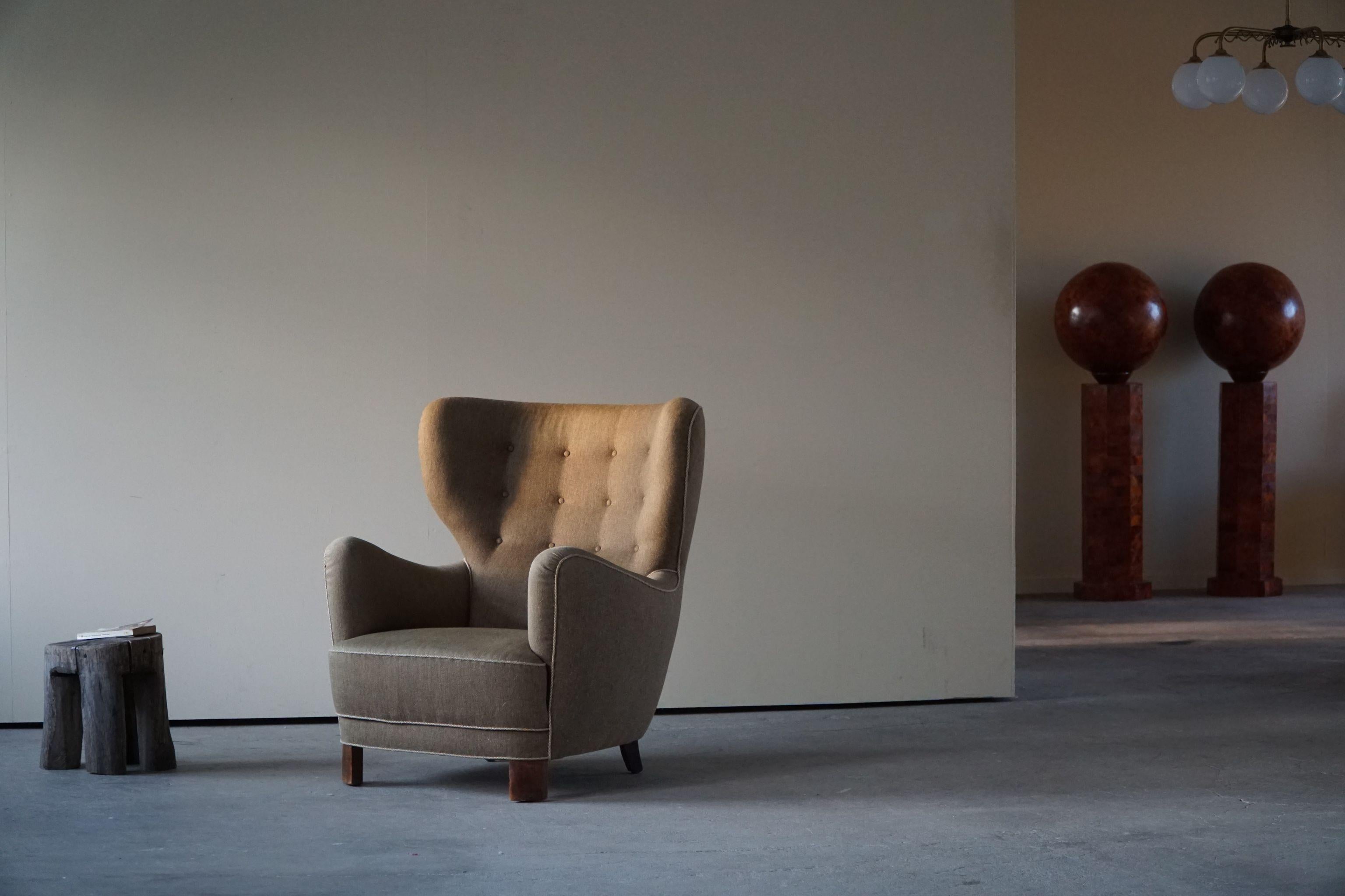 Such a voluminous and comfortable lounge chair made in the style of Flemming Lassen.
Intriguing shape and curves featured in this teddy bear, crafted by a skilled cabinetmaker in Denmark, ca 1940s.

This lovely armchair will complement many