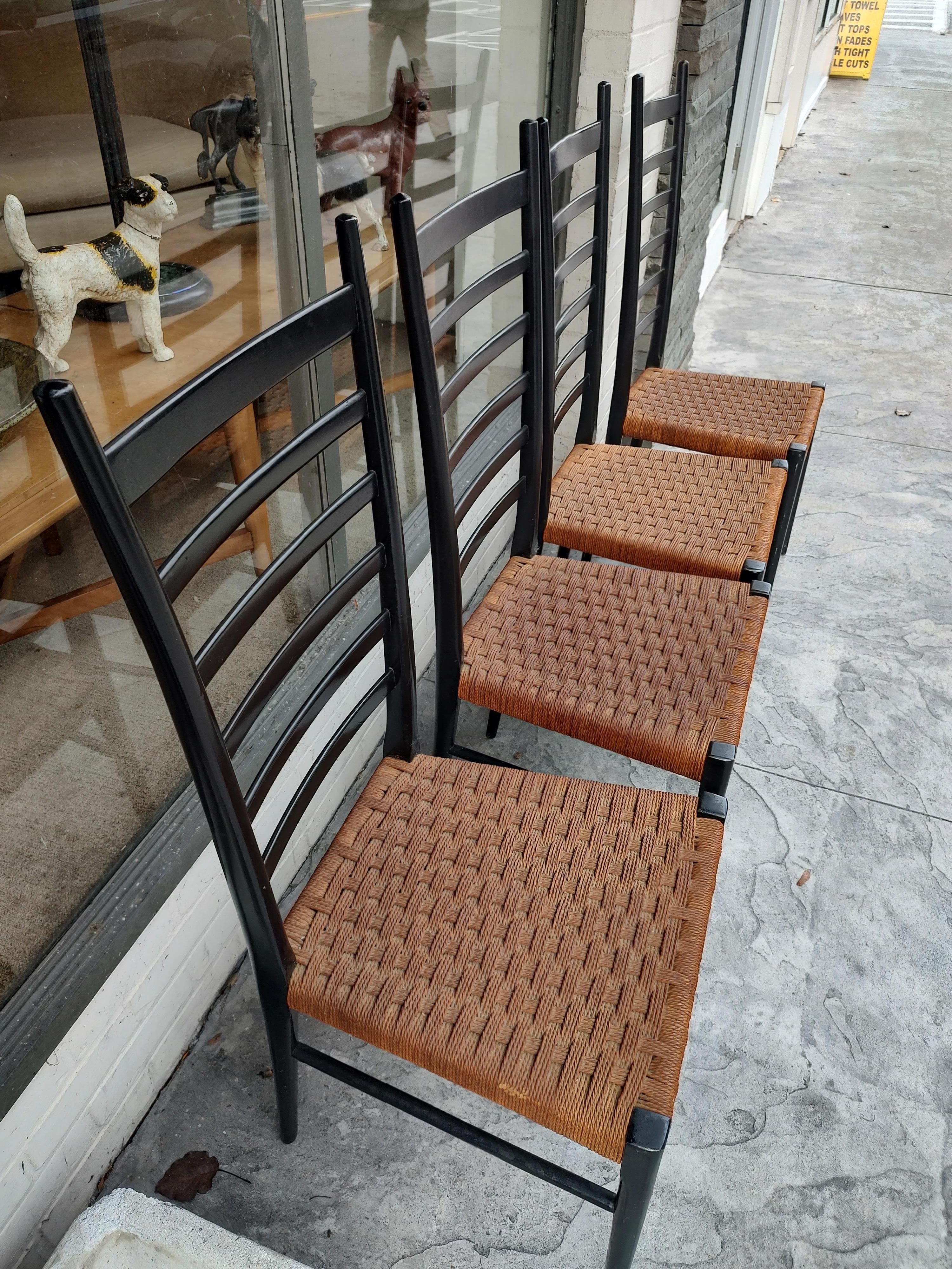 Fabulous set of 4 tall ladder back chairs with woven rope seats. Original in every sense and in excellent vintage condition with minimal wear. Chairs were in dry storage for a large number of years and have aged well. Very tight and little nicks but