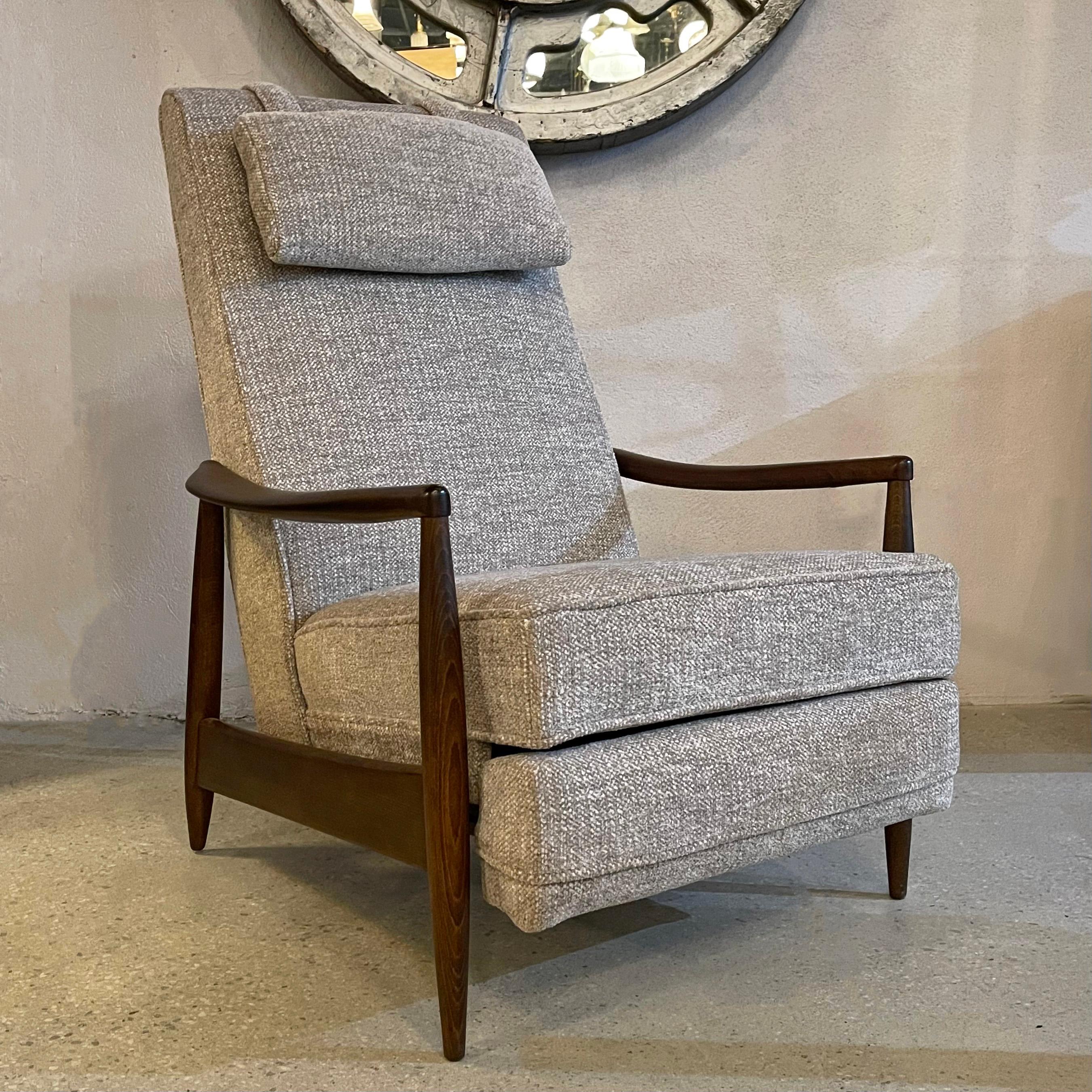 Mid-century modern, recliner lounge chair features an ebonized maple frame and soft, oatmeal chenille upholstery. The chair fully reclines to 56 inches deep to enjoy a good nap. The removeable head cushion is weighted to stay in place. The arm