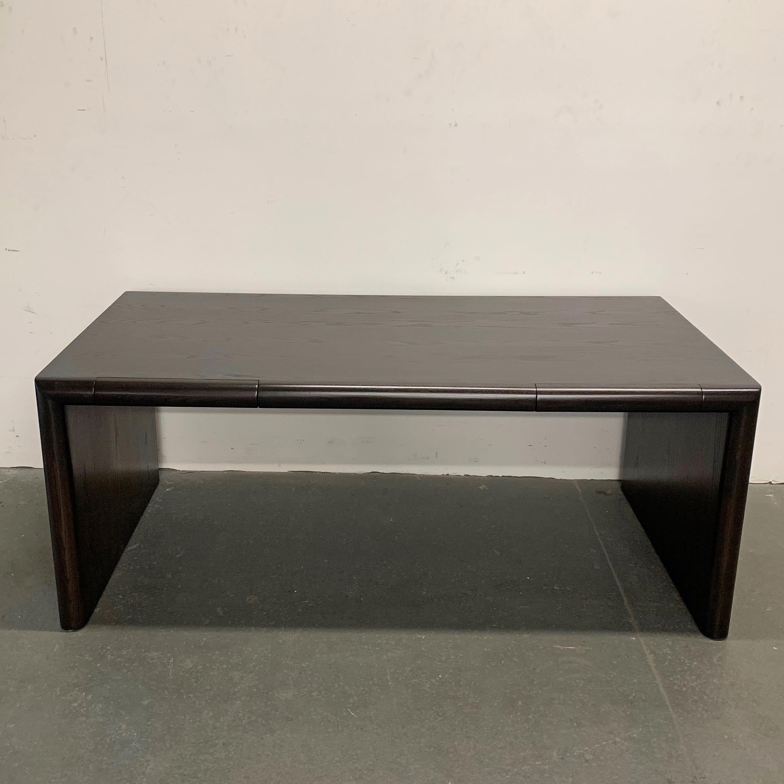 Sleek and minimal, Mid-Century Modern, ebonized oak, partners desk features bullnose, bevel edges with two drawers.