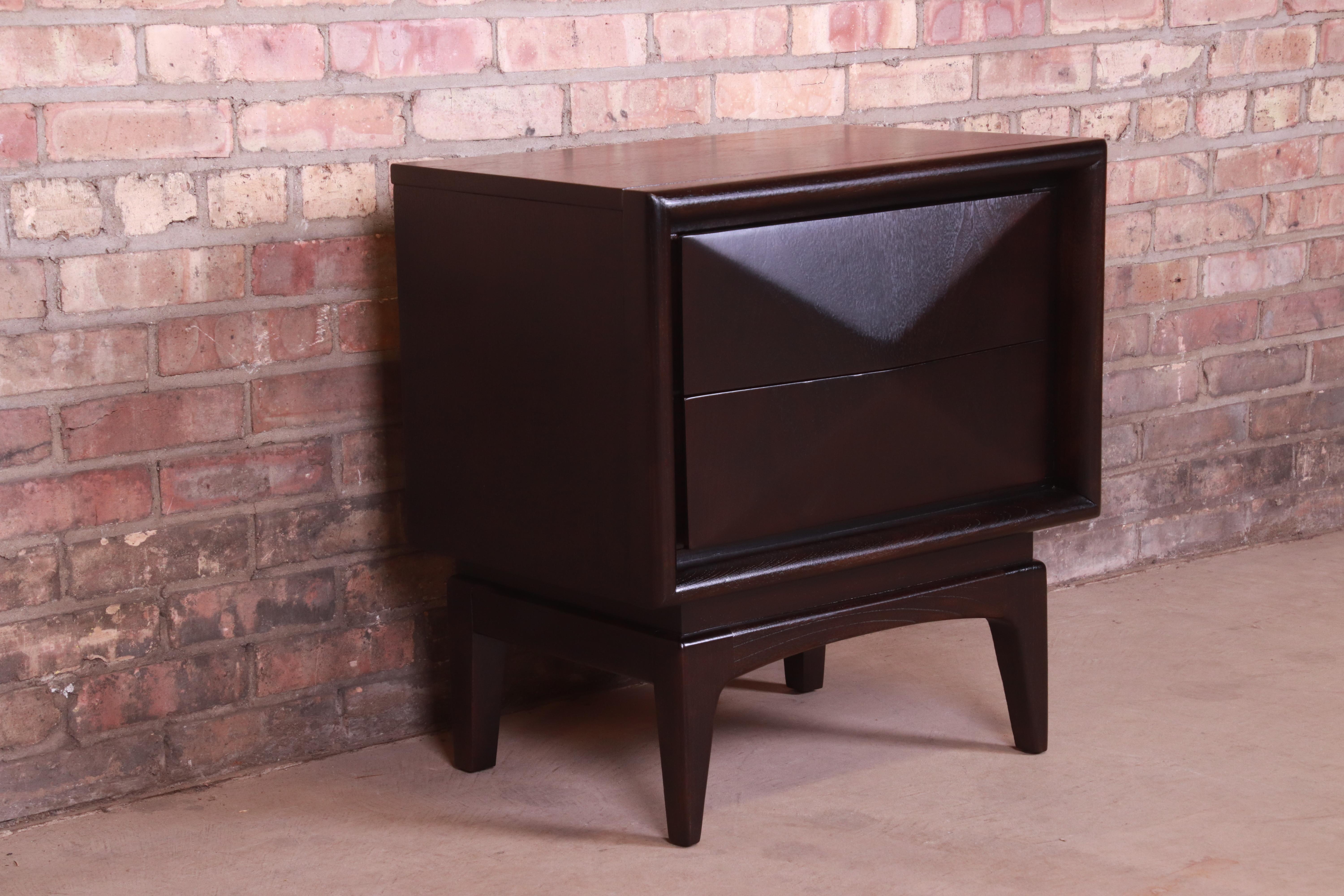 A stunning mid-century modern diamond front nightstand

In the manner of Vladimir Kagan

By United Furniture Co.

USA, 1960s

Ebonized walnut, with unique sculpted diamond front design.

Measures: 23