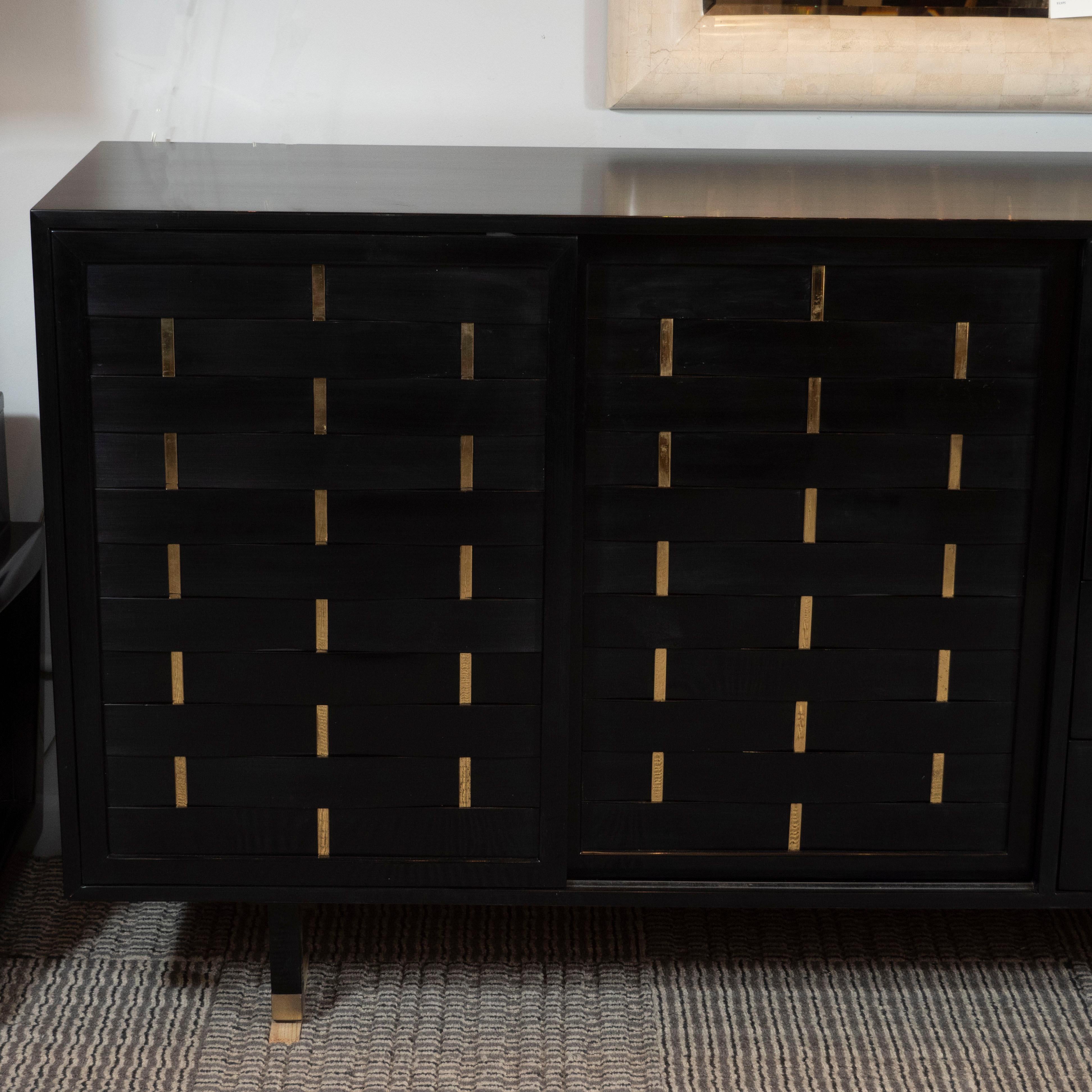 This sophisticated sideboard was designed by Harvey Probber, circa 1960- and handmade in Fall River, Massachusettes. Probber was a pioneering force in American modernism. He created highly-sought after pieces that were thoroughly modern but less
