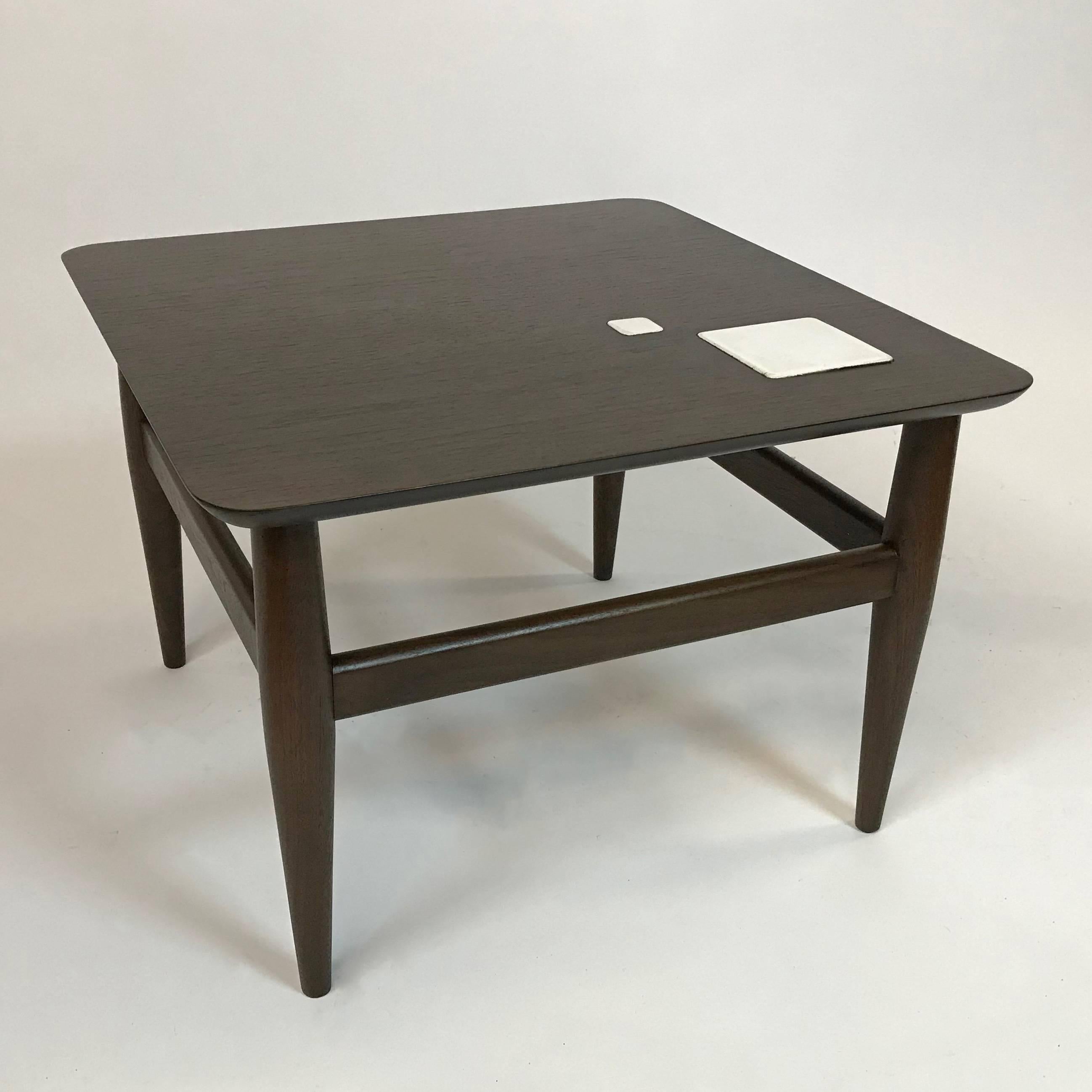 Mid-Century Modern, ebonized walnut, side coffee table features a contrasting white ceramic tile inlay.