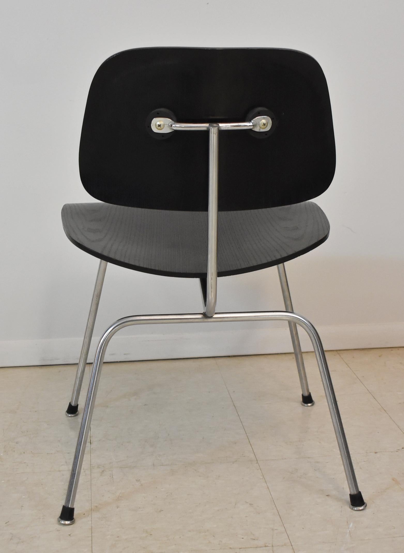 Mid-Century Modern ebonized wood and chrome chair by DCM Eames. Very nice condition. Dimensions: 21