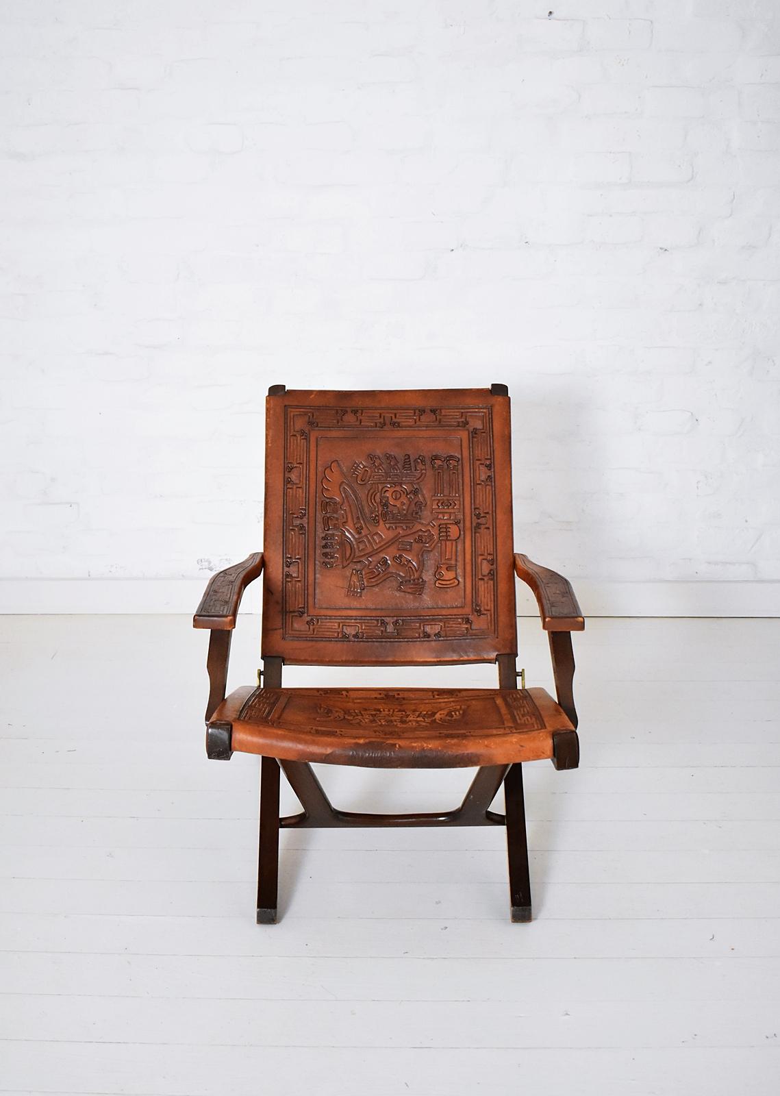 This folding chair was designed by Angel Pazmino. It was produced by Muebles de Estilo.
Pazmino was inspired by Danish designer Hans Wegner and designed his own folding chair.
 Saddle leather and wood with Inca motive.
 






     