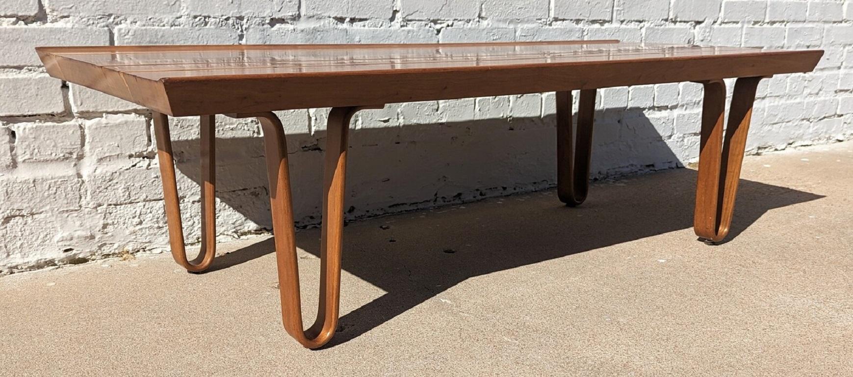 Mid Century Modern Edward Wormley for Dunbar Coffee Table Bench

Good vintage condition and structurally sound. Top has some scratching in the middle and some expected finish wear.
Additional information:
Materials: Walnut.Oak
Vintage from the