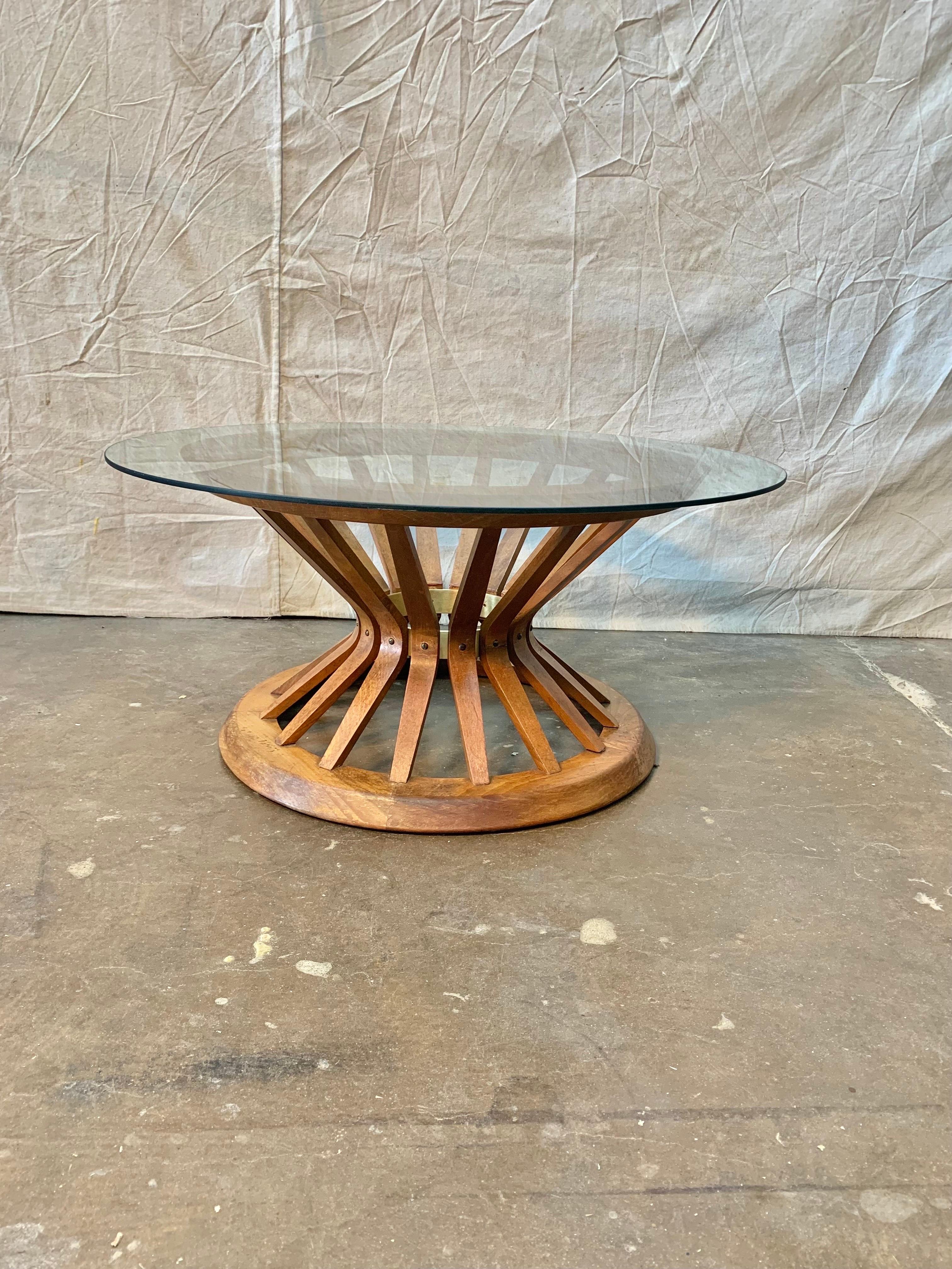 This Sheaf of Wheat Coffee or Cocktail Table was created in the 1960's and designed by Edward Wormley for Dunbar. The spindel base is crafted from walnut and bound with a brass interior band inspired by the natural beauty of a sheaf of wheat. The