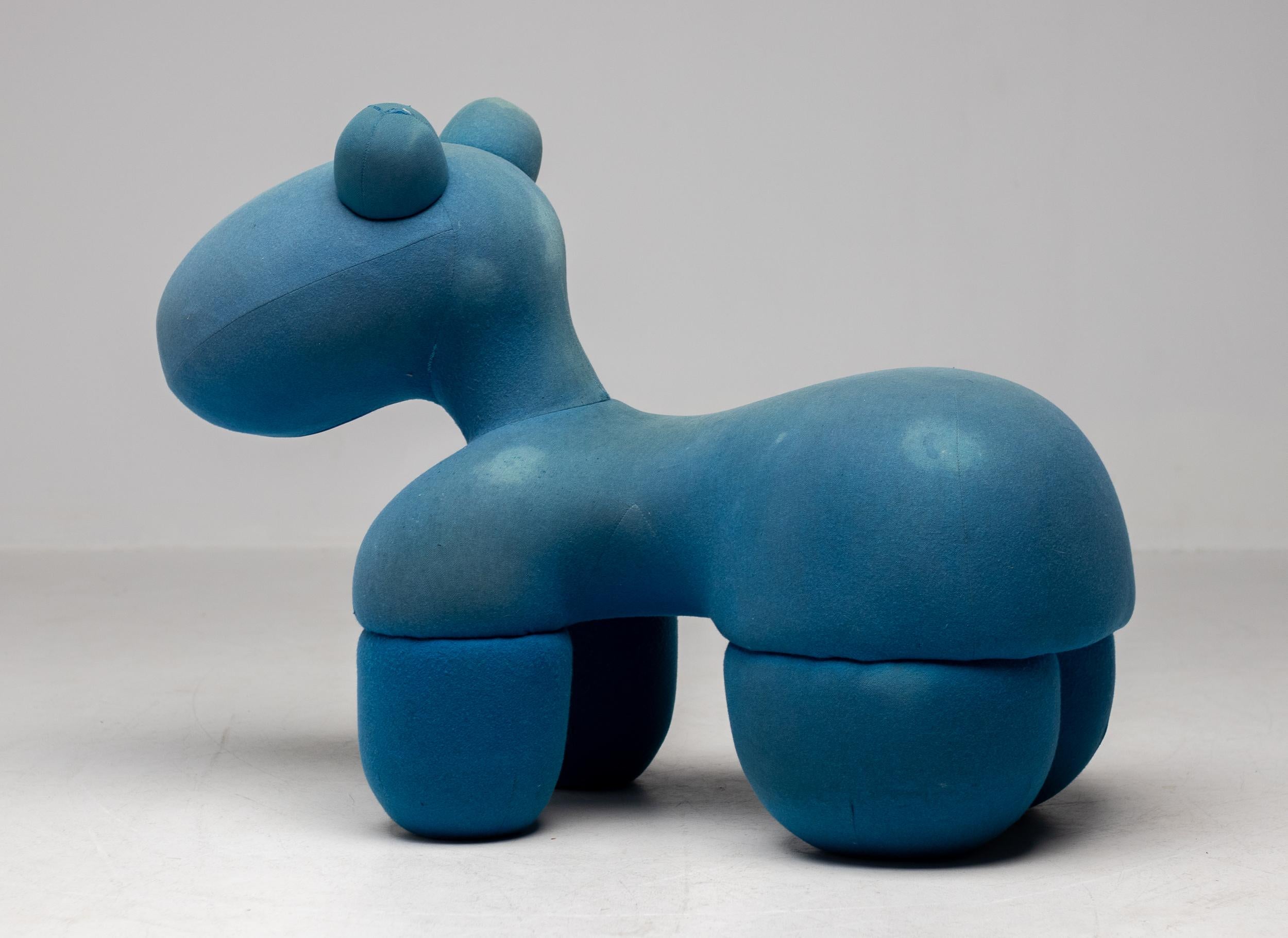 Rare, playful and iconic Pony Chair by designer Eero Aarnio in original blue fabric. The Pony Chair was designed by the Finnish designer in 1973 and has been a staple of contemporary design ever since. Internal steel frame. Extremely sturdy object.