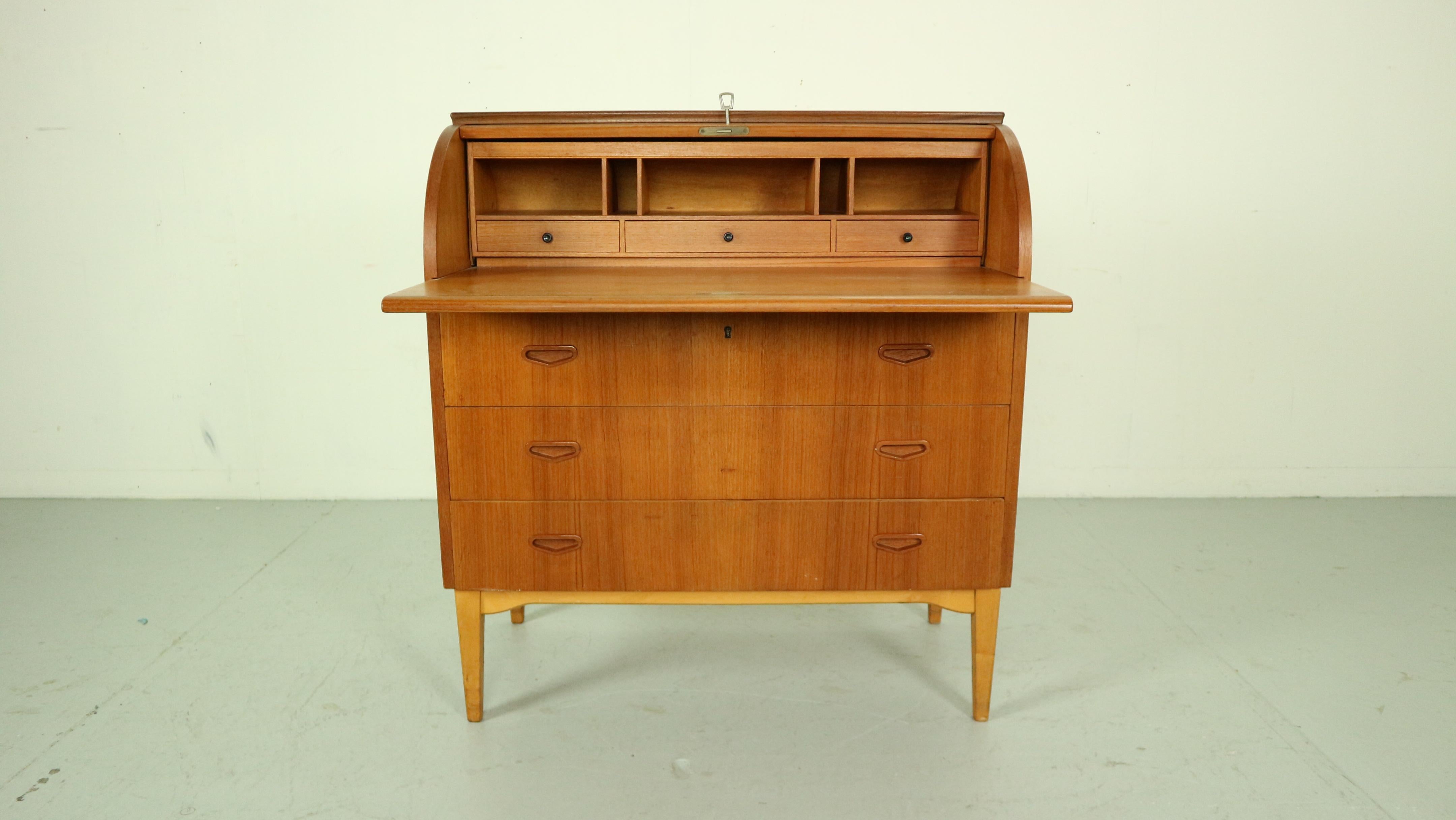 Mid- Century modern period teak cylinder rolltop secretary/ desk or just a cabinet is made in 1970s, Sweden.
By Egon Ostergaard designer and manufactured by Markaryds Mobelindustri manufacture.

The Classic Scandinavian Modern design has clean