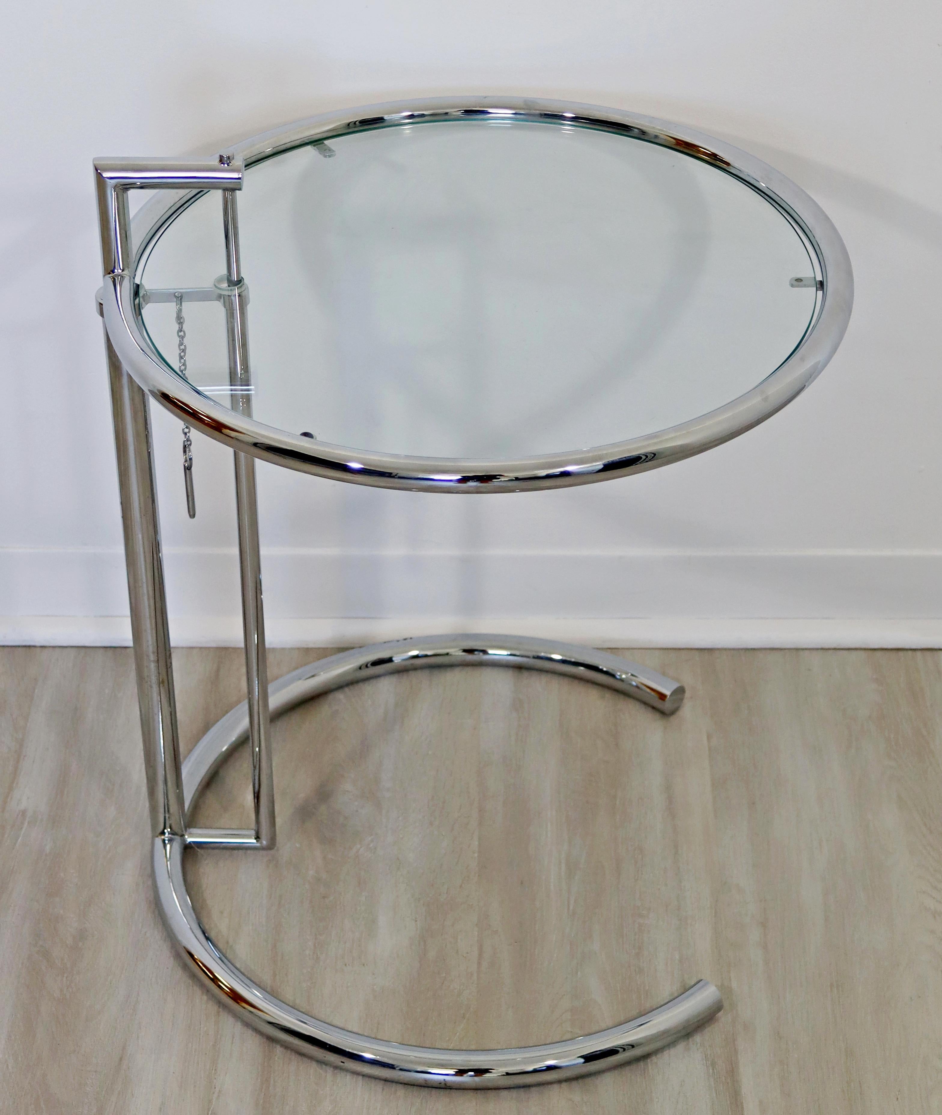 For your consideration is an outstanding, adjustable, round coffee table, made of glass and chrome, by Eileen Gray, circa the 1970s. In excellent vintage condition. The dimensions are 20