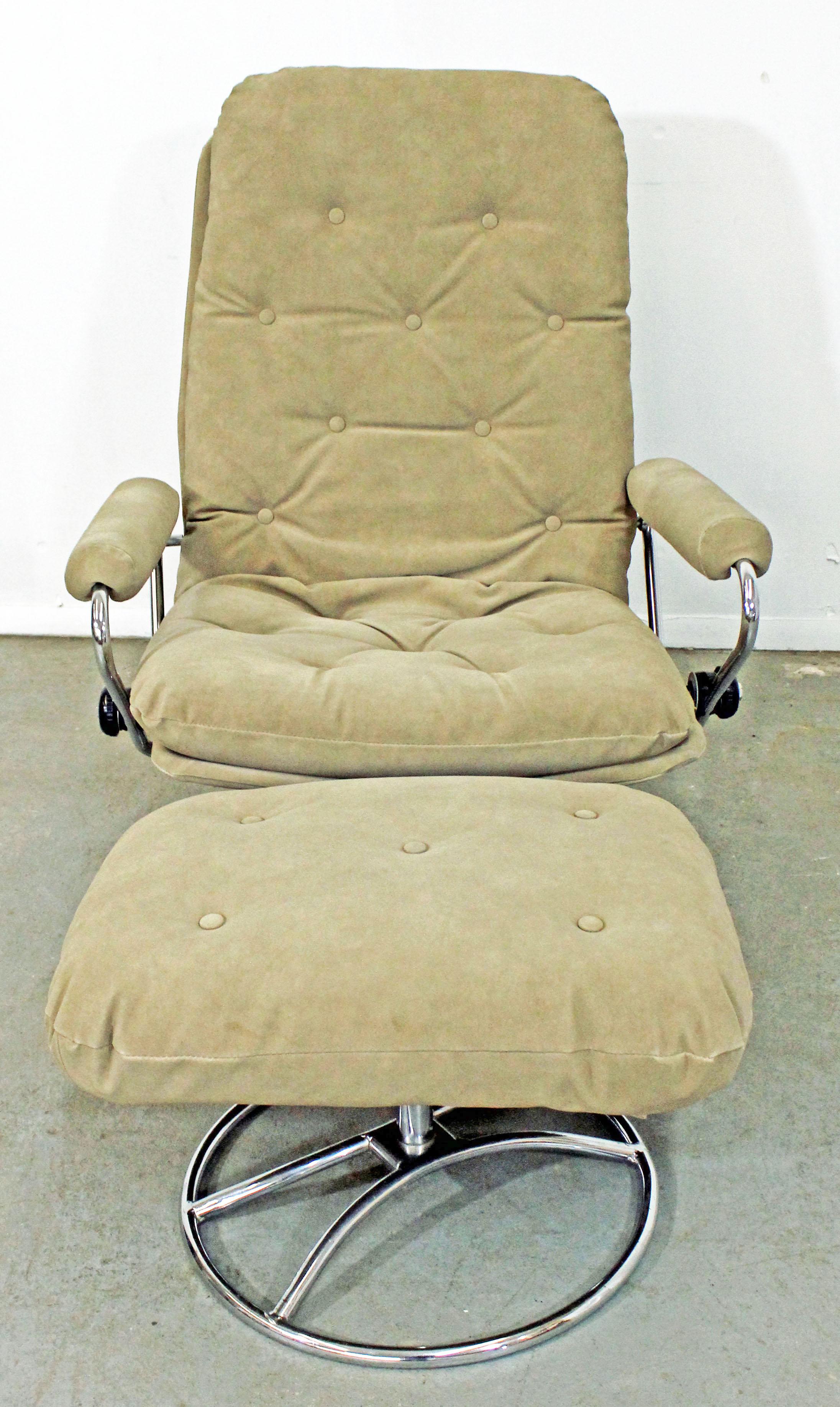What a find. Offered is a Mid-Century Modern lounge chair and ottoman by Ekornes Stressless of Norway. The chair has a chrome base and suede style upholstery, plus it swivels and reclines. It is in good condition considering its age, showing little