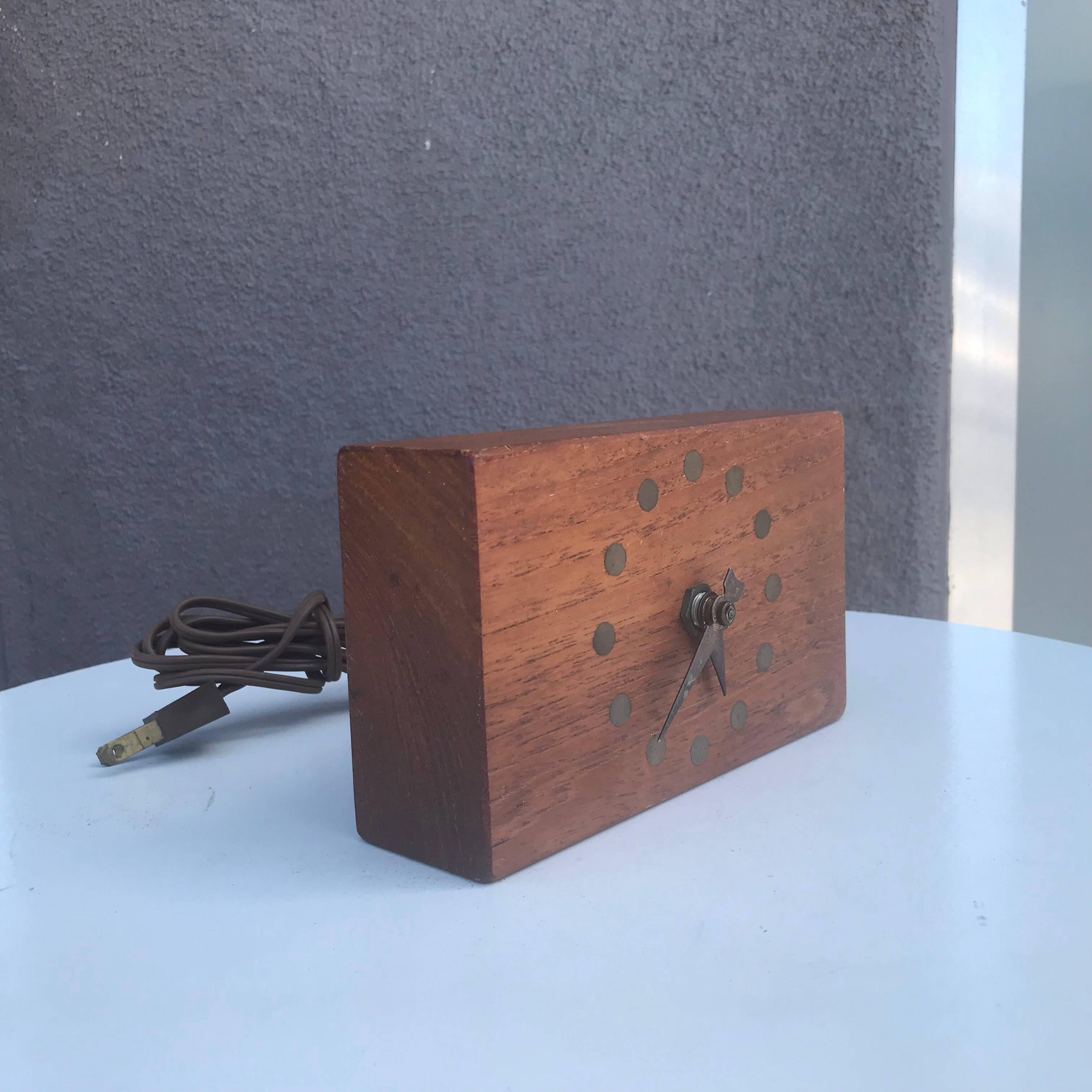 For your consideration, a Mid-Century Modern electric table clock teak and brass.
Dimensions: 3 7/8