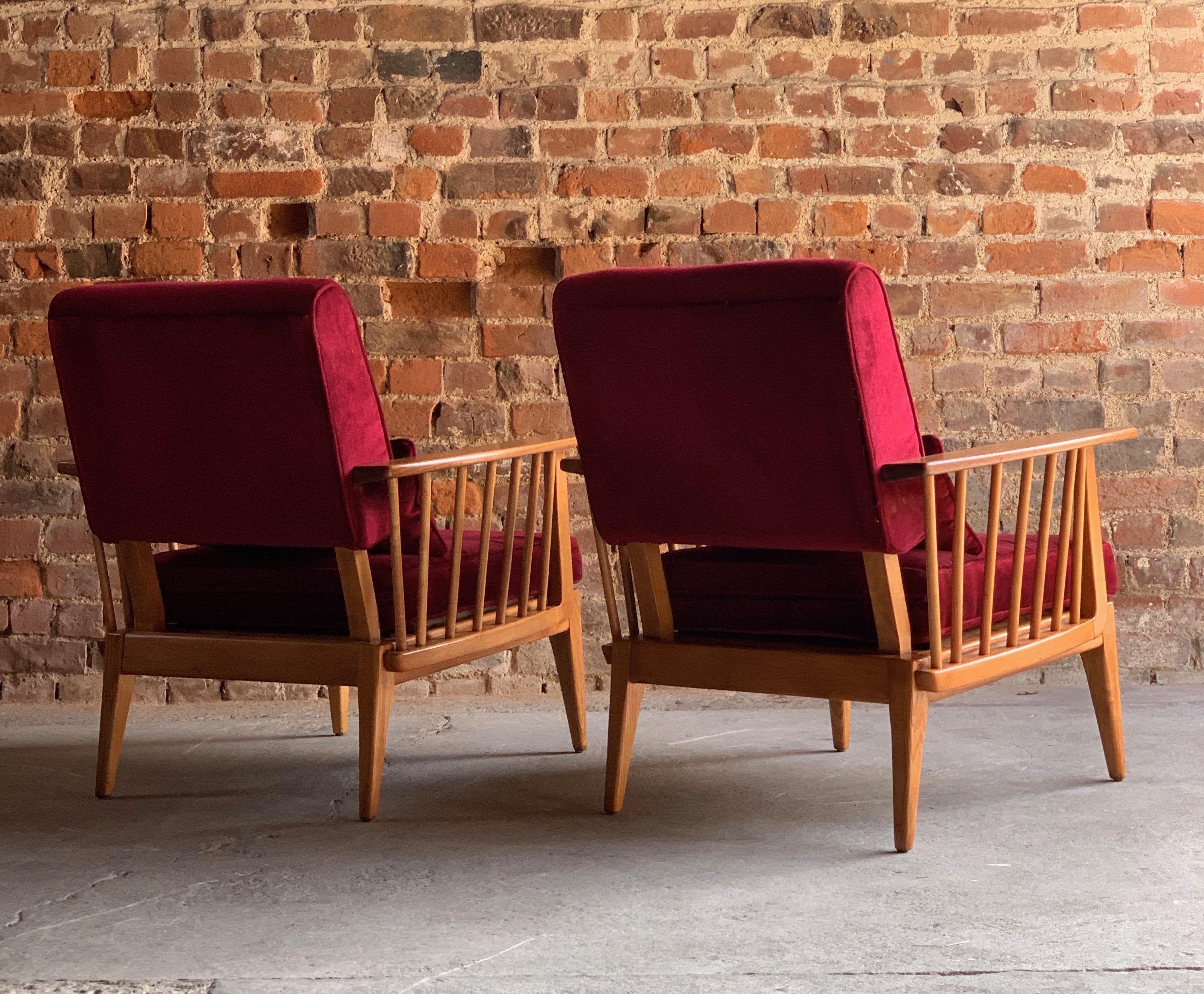 Mid-Century Modern Elm Armchairs Lounge Chairs Pair Danish Circa 1960s

Magnificent midcentury Blonde Elm three-piece Lounge Suite circa 1960, comprising of three-seat sofa and two matching armchairs dressed in cranberry red velvet upholstery with
