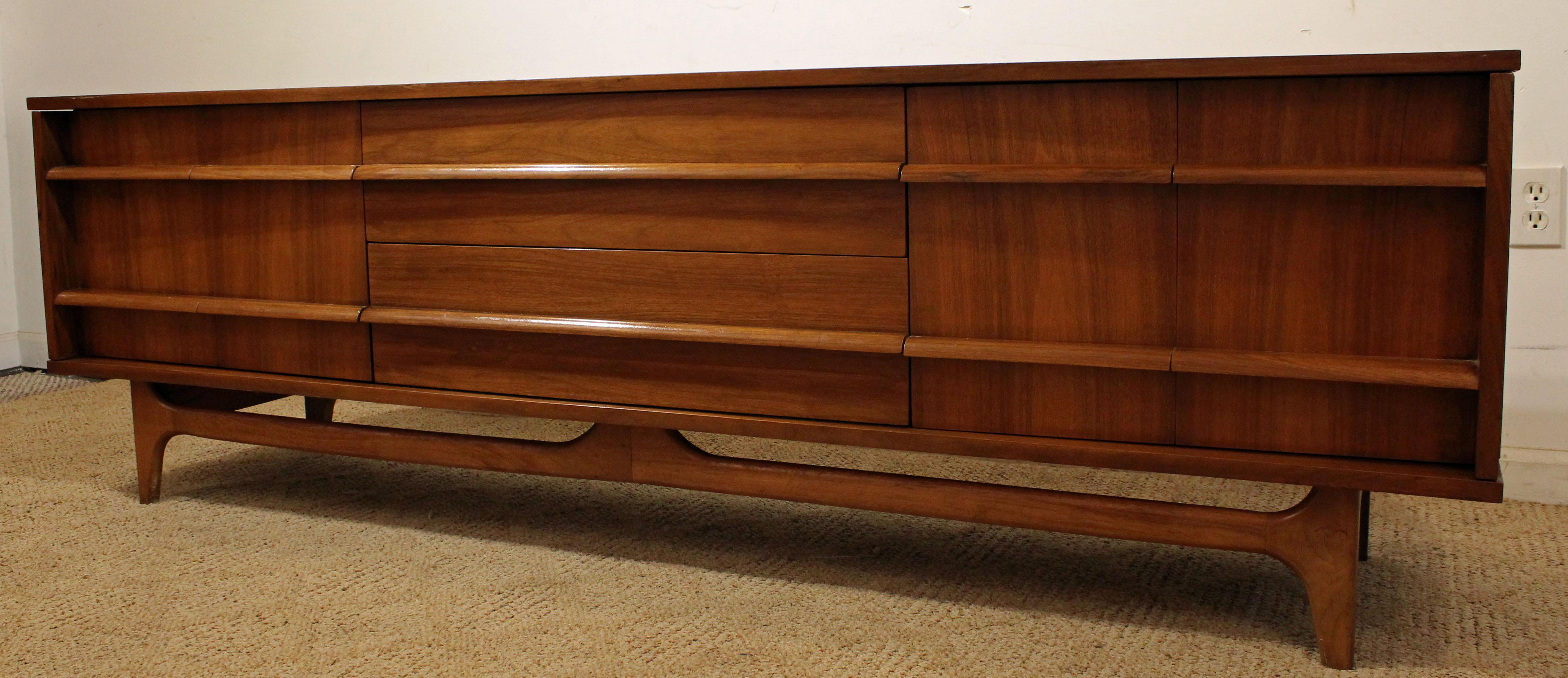 American Mid-Century Modern Elongated Low Concave-Front Walnut Credenza