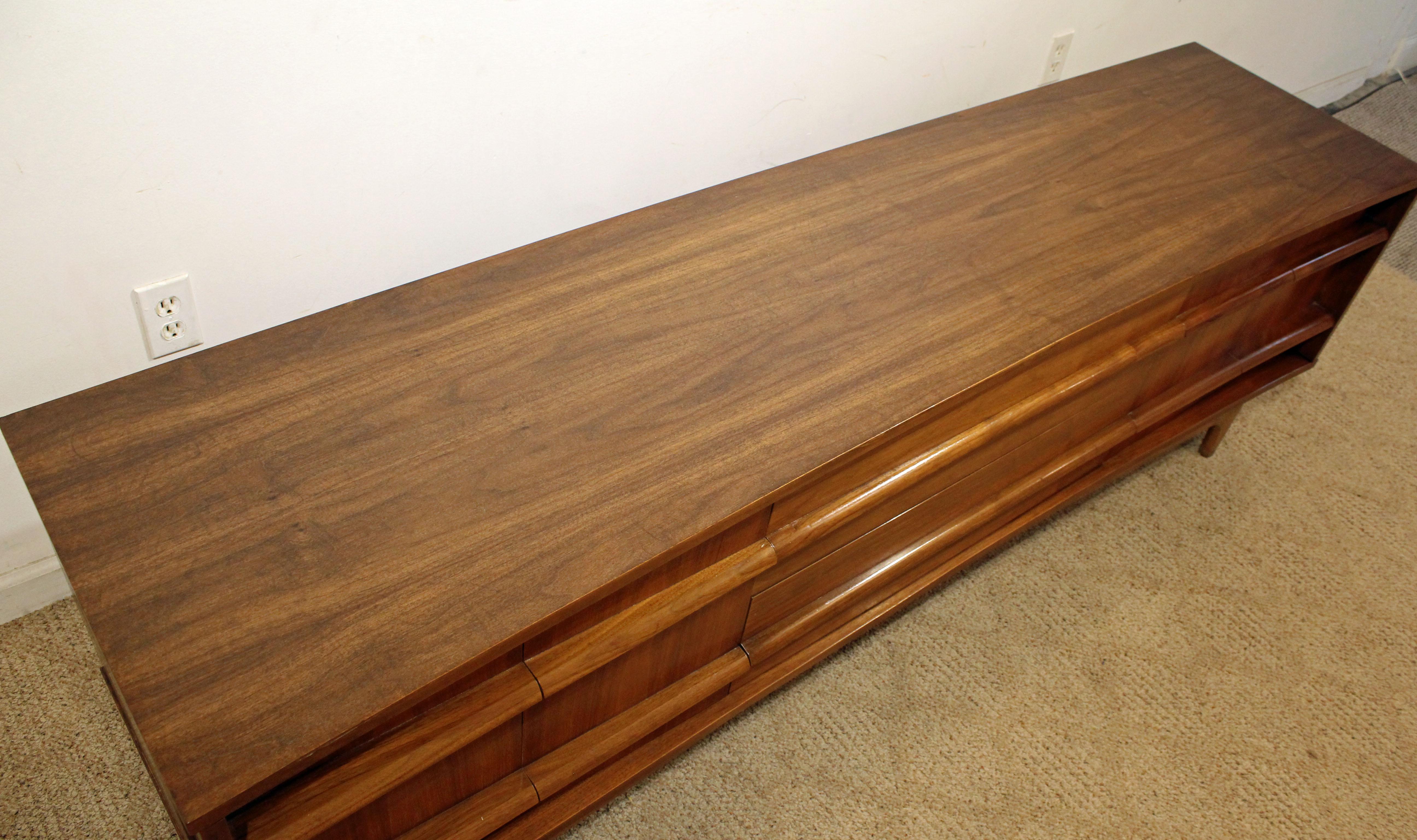 Mid-20th Century Mid-Century Modern Elongated Low Concave-Front Walnut Credenza