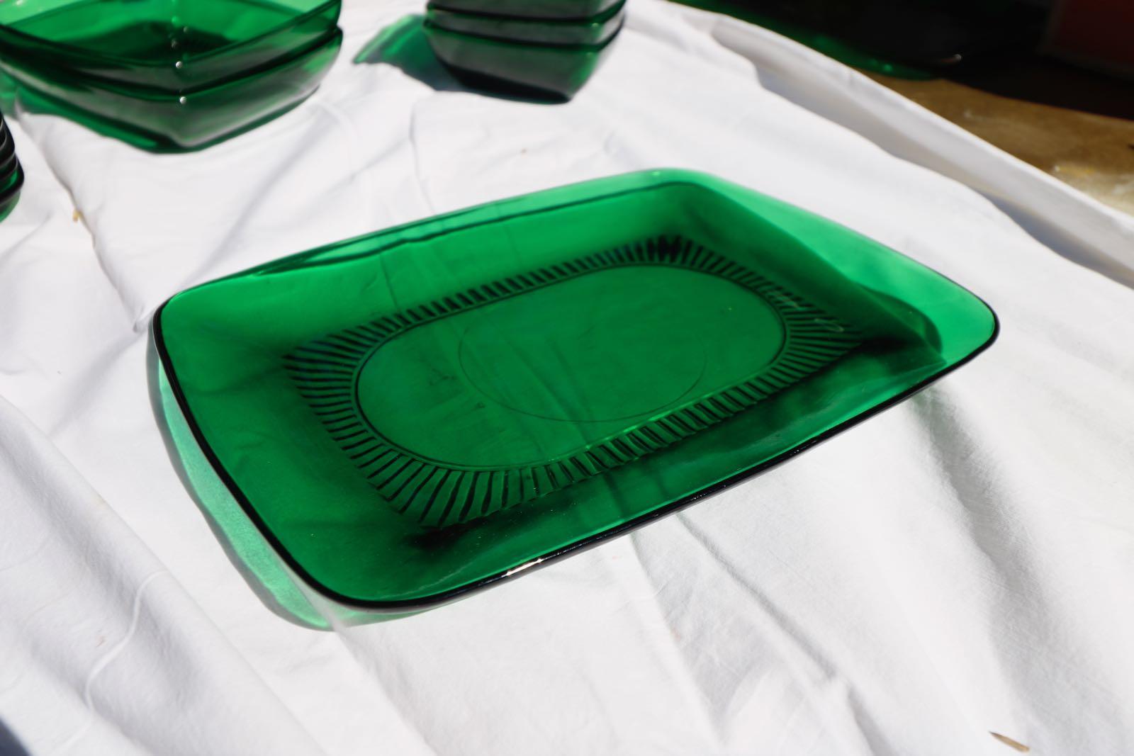 Mid-Century Modern emerald green glass dishware serving set. A varied group of two Rectangular Serving Trays, 3 Soup Cups, 5 coffee cups, 6 Dinner Plates, 4 Medium Plates, 8 Small Dessert Plates, 6 tea Plates, 2 salad medium bowls and 4 Small Bowls.