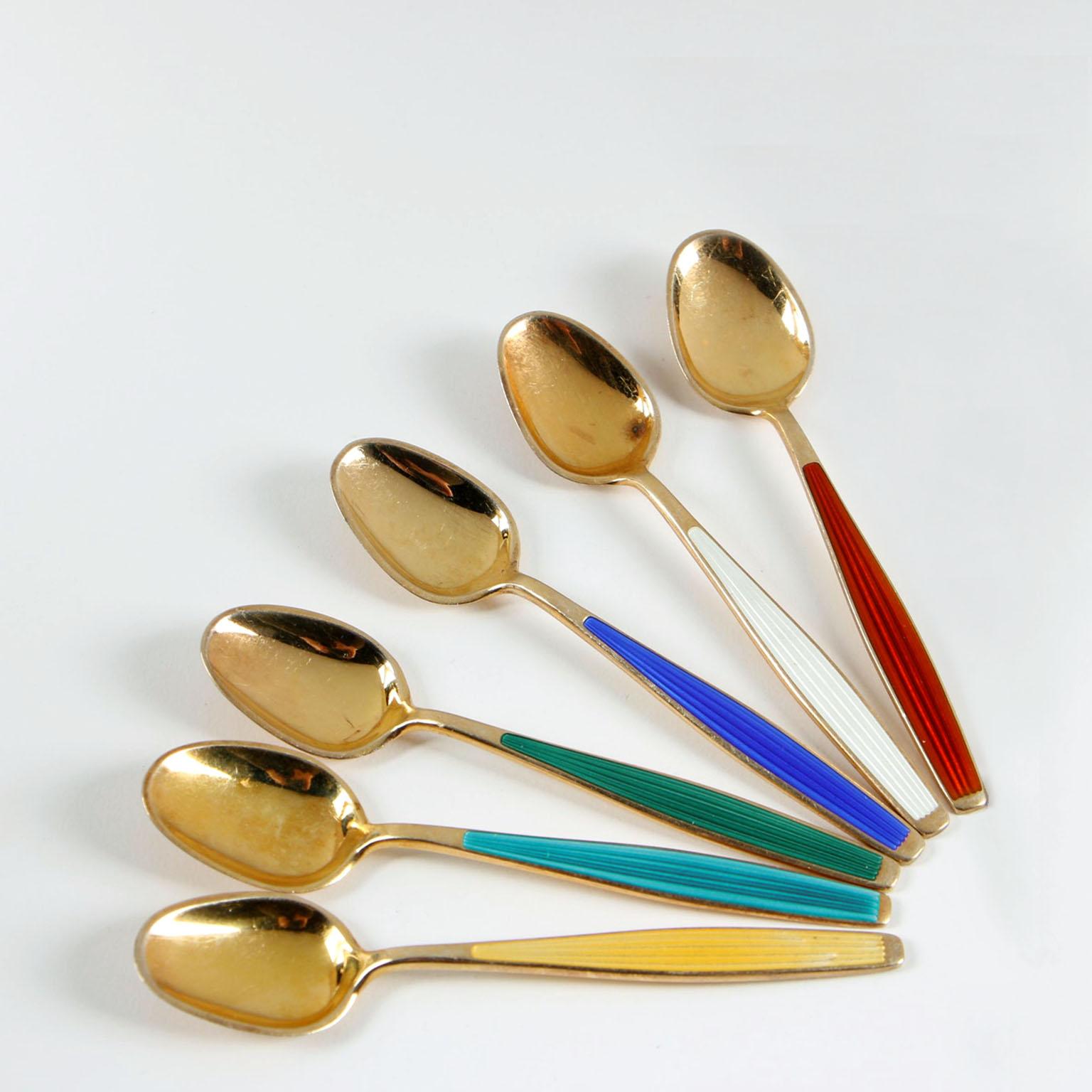 Twelve midcentury demitasse spoons, J.T. Norway, 1950s.
Clean line design, the pattern is very characteristic of the 1950s. Each spoon is made of sterling silver, richly gilt, stripes engraved pattern to the handle, filled and decorated with enamel
