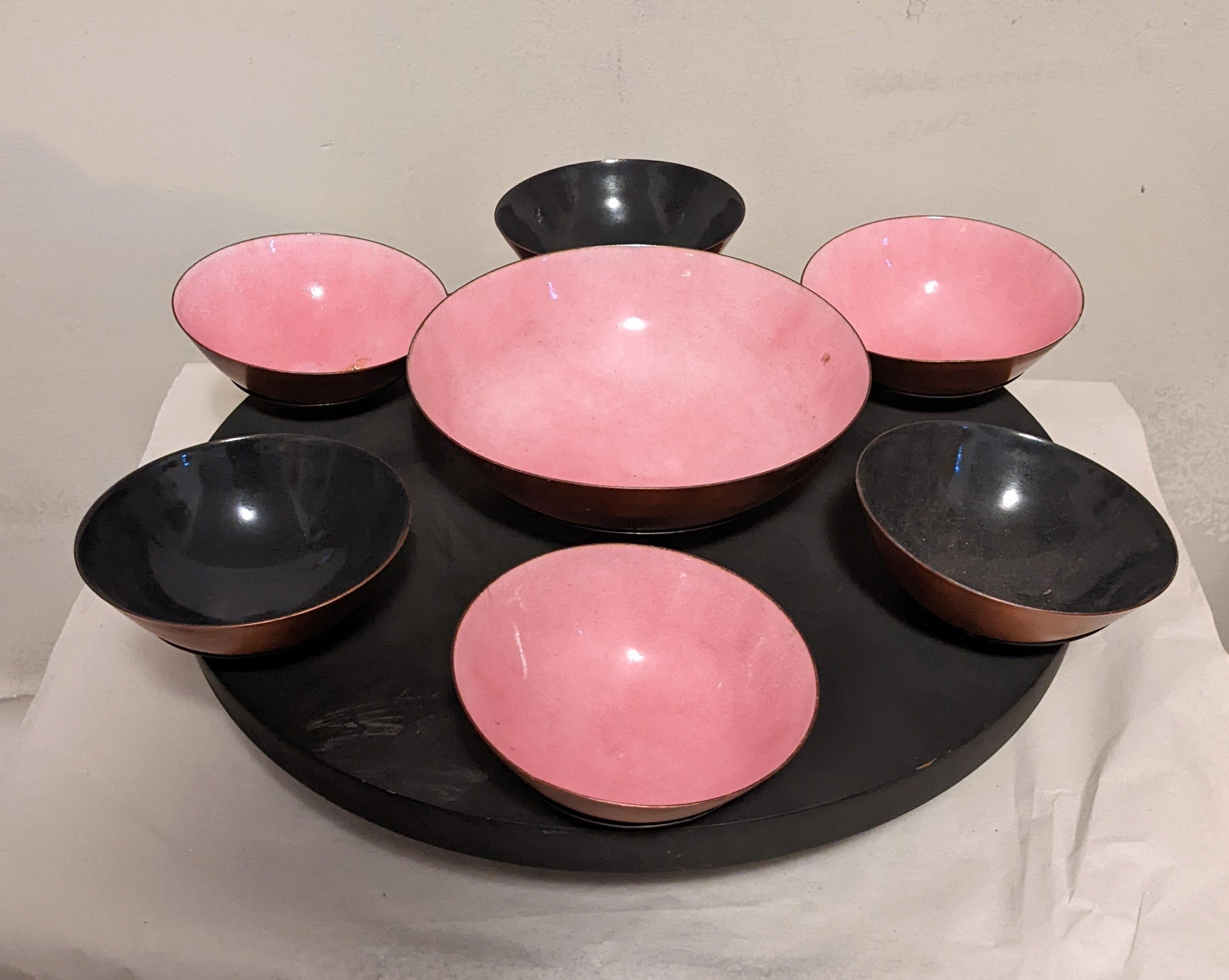 California modern handmade Mid-Century Modern Lazy Susan server of wood with enameled copper bowls in vibrant pink and black by Marrell. Bowls sit on a hand made wood base with ball bearings in base as turning mechanism. As it is hand made, its not