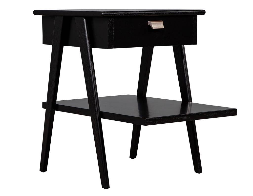 Mid-Century Modern end table in the manner of Kipp Stewart & Stewart MacDougall. Original 1970s American midcentury design A-frame legs. Masterfully restored in a satin black finish with metal pulls.

Price includes complimentary scheduled curb