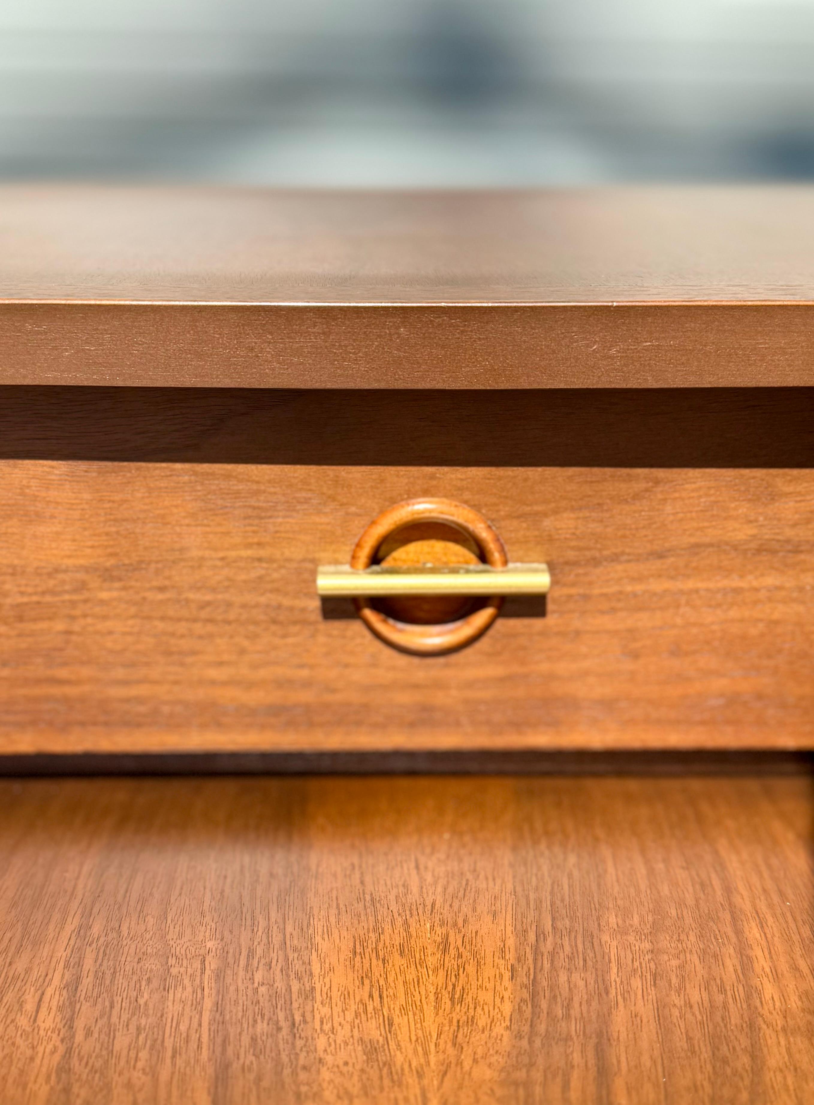 Unique and sculptural mid-century side tables by Bassett. Beautiful walnut. They have operating drawers in each. Fully refinished tops using all Mohawk products. Light Knicks appropriate with age. 