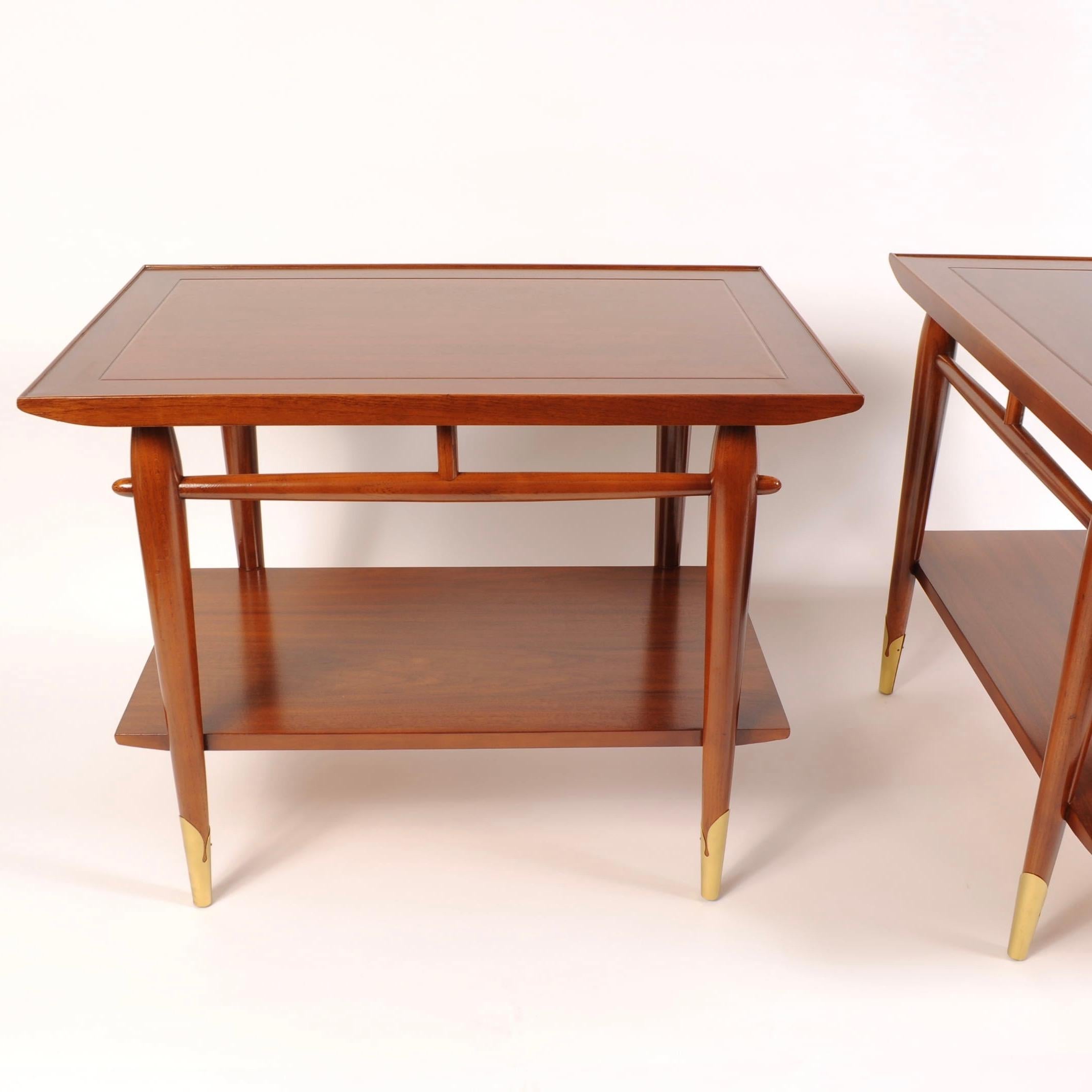 1960s era walnut end tables featuring lower shelves and sculptured legs with brass end caps. As clean a set as you could expect after 55+ years.