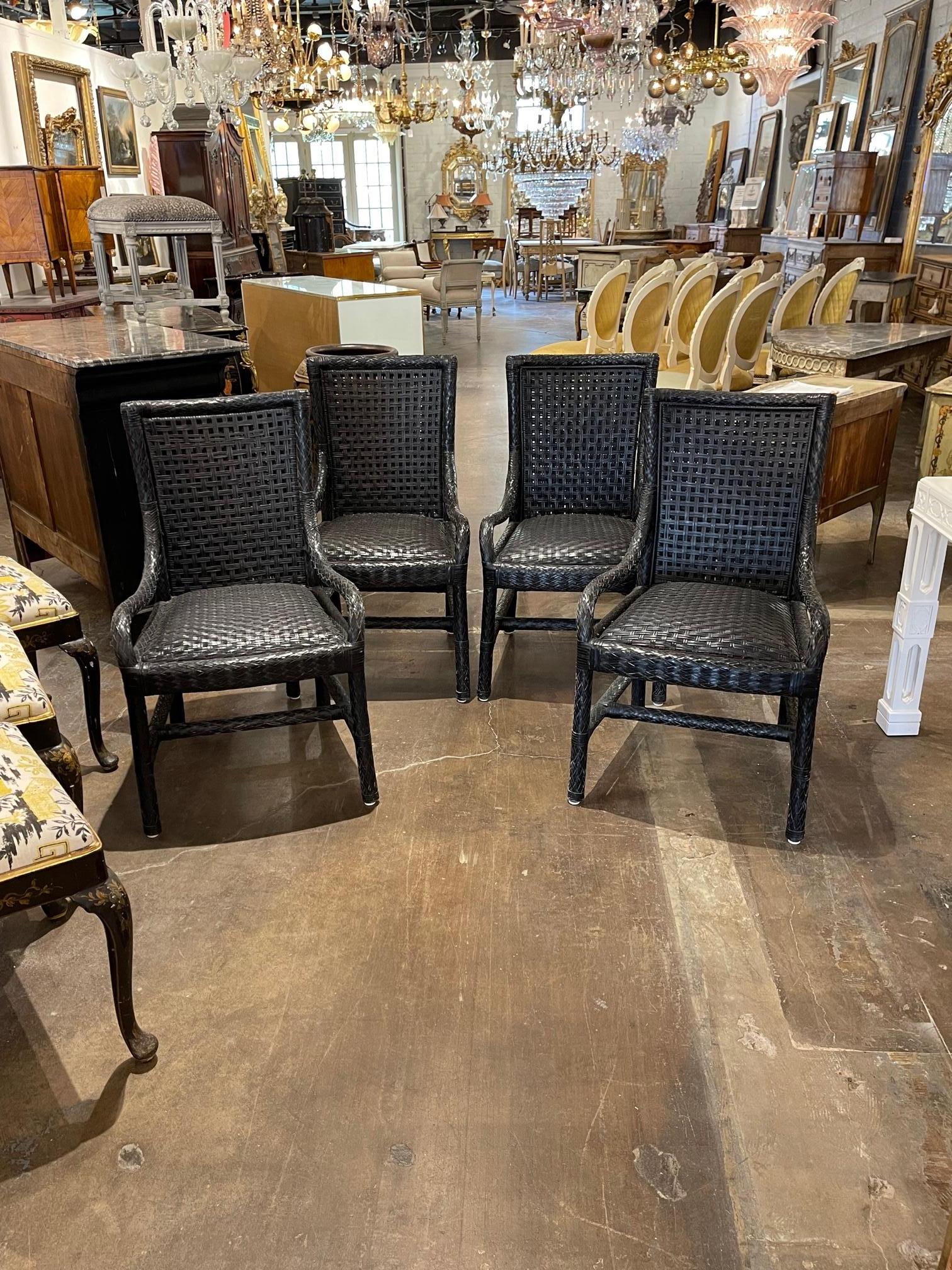 Priced per pair, Mid-Century Modern woven black leather armchairs from England. Very handsome for a study or library. Note: They are sold by the pair and there are 2 pairs available.