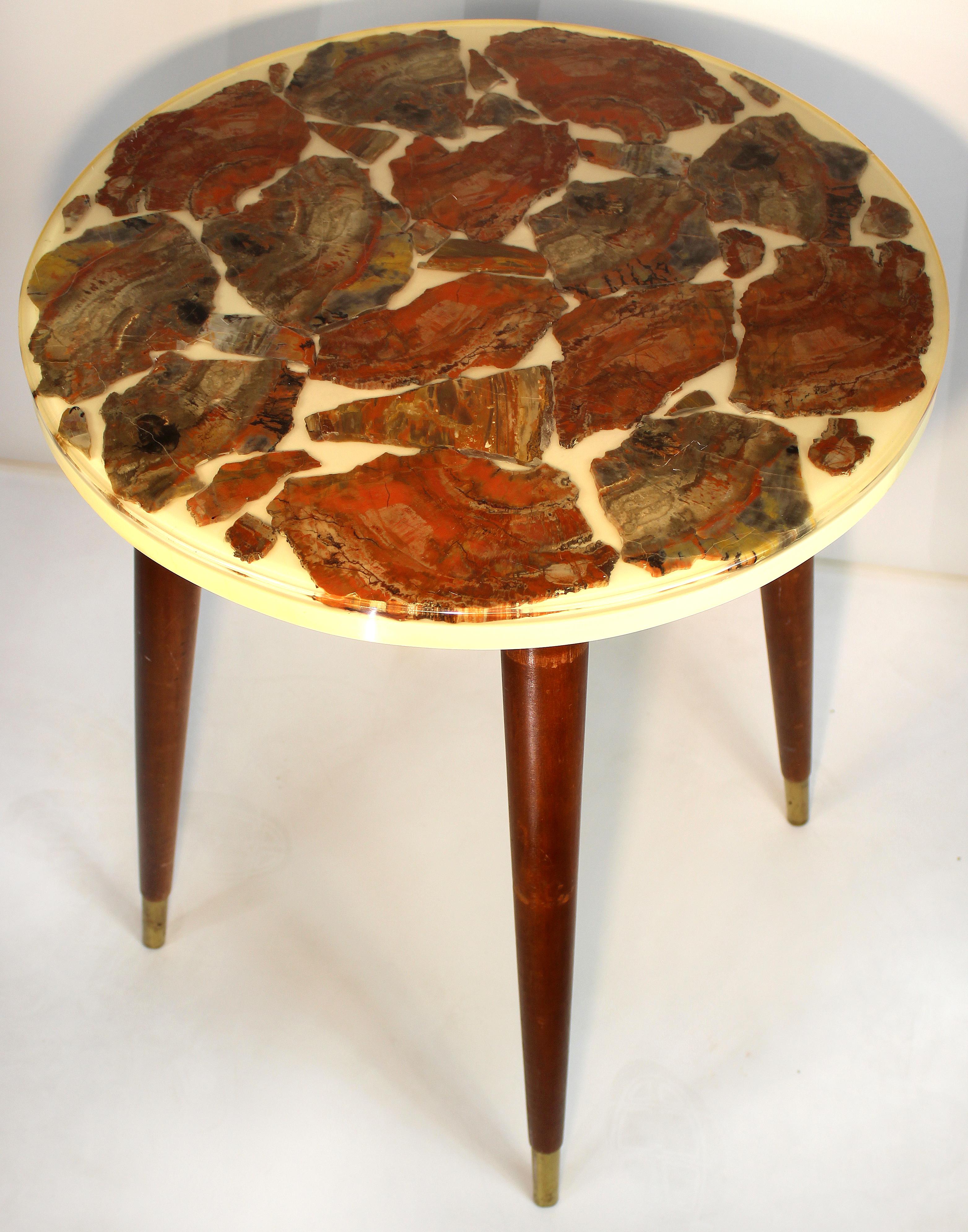 Midcentury Modern Epoxy Resin Petrified Wood Specimen Occasional Table

Offered for sale is a Mid-Century Modern epoxy resin petrified wood specimen occasional table supported by conical tapering legs with brass caps.

 