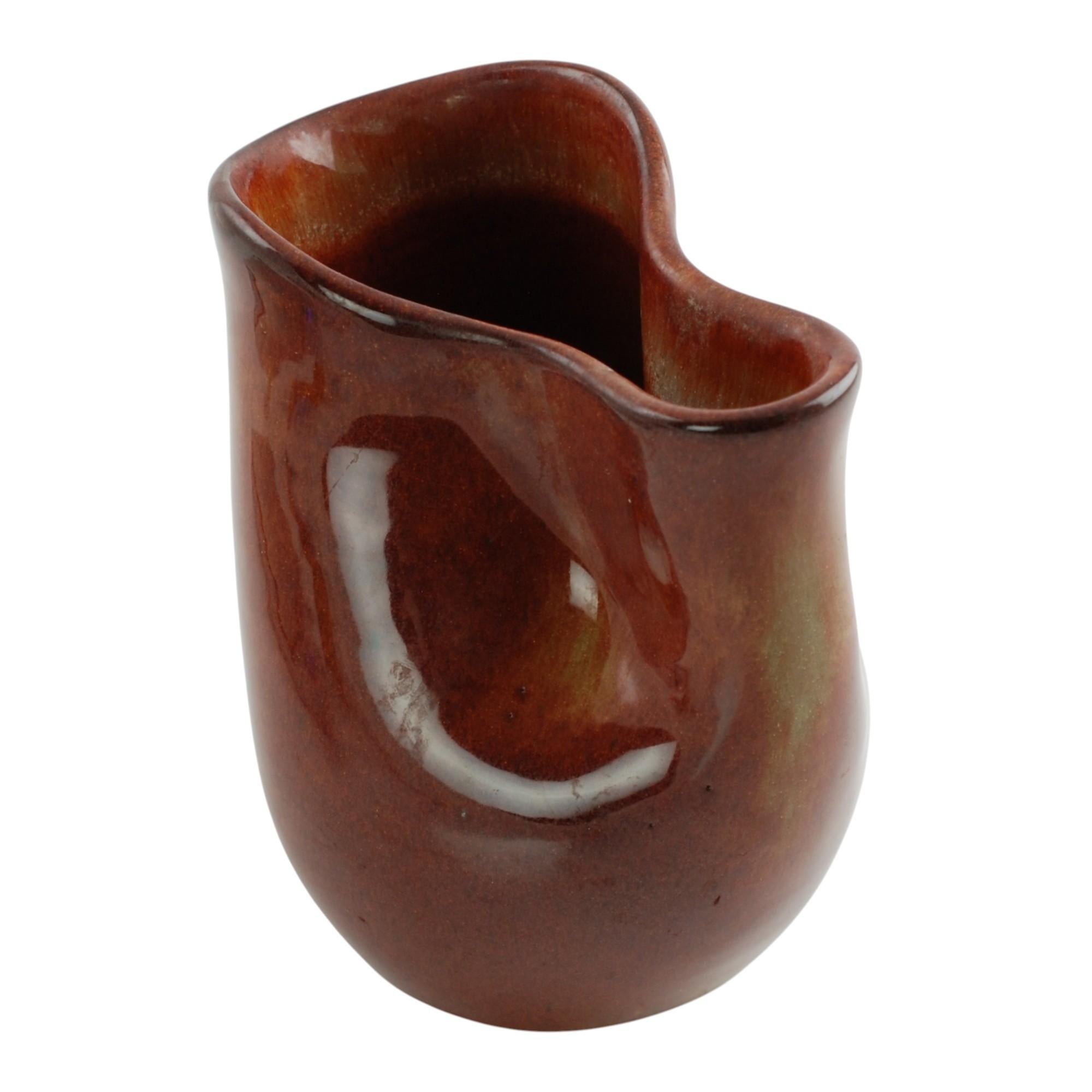 This glazed ceramic pitcher was made by noted Hungarian-born studio potter Eugene Deutch (1904-1959). Deutch studied under modernist sculptor Constantin Brancusi in Paris before emigrating to the United States and establishing a studio in Chicago.
