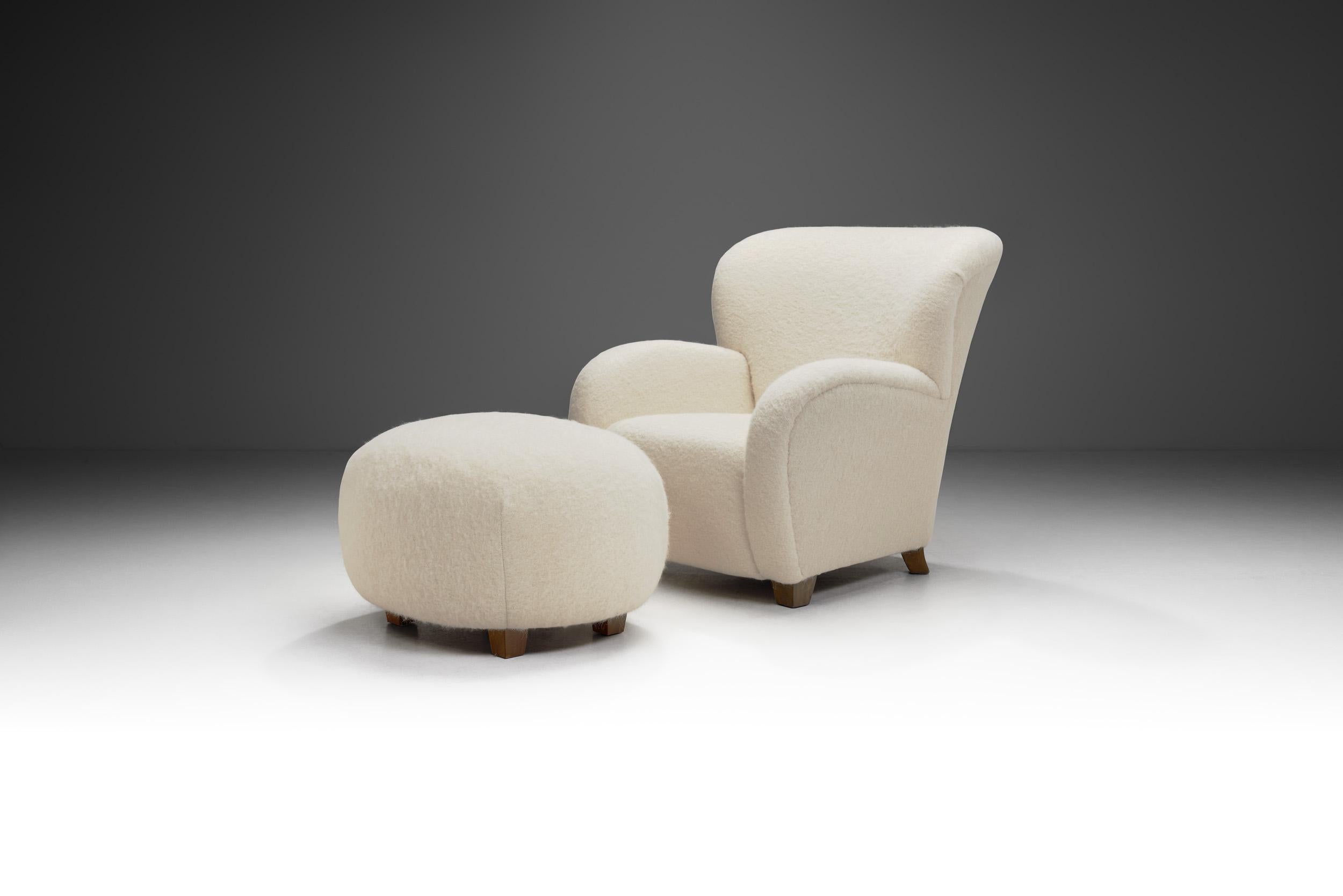 This pair of lounge chair and ottoman is an elegant and comfortable evidence of the mastery and artistry of the European cabinetmakers who defined mid-20th century modern seating. This duo is of the highest quality, both in terms of visual quality,