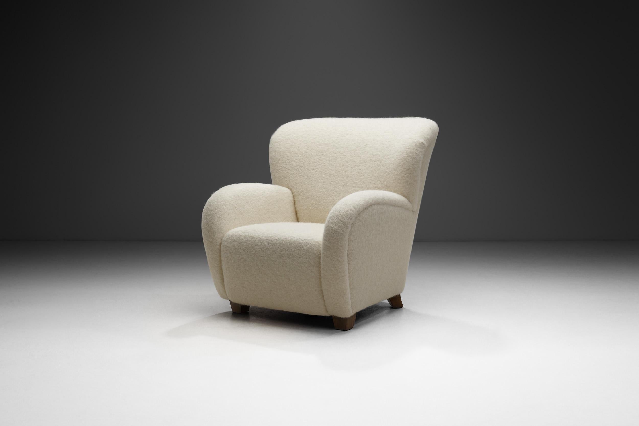 This lounge chair is an elegant and comfortable evidence of the mastery and artistry of the European cabinetmakers who defined mid-20th century modern seating. This chair is of the highest quality, both in terms of visual quality, materials, and