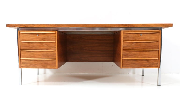 Magnificent and rare Mid-Century Modern executive desk.
Design by Hein Salomonson & Theo Tempelman for AP Originals.
Striking Dutch design from the 1960s.
Heavy chrome steel frame and the wood is original veneered with high quality walnut